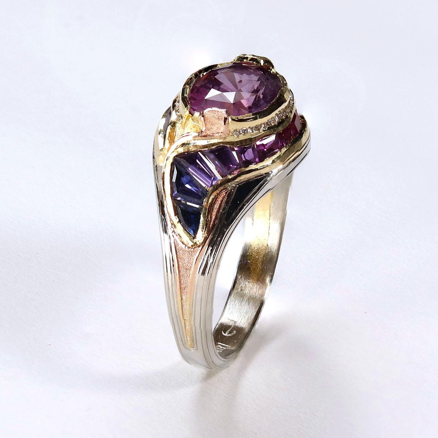 So happy to share this fantastic purple sapphire gradient engagement ring! Featuring a 3.23ct purple sapphire, 1.2ct of custom cut sapphire along with .07ct .5mm diamonds&hellip;
This ring was cast in 18k yellow gold then overcast with 18k white gold