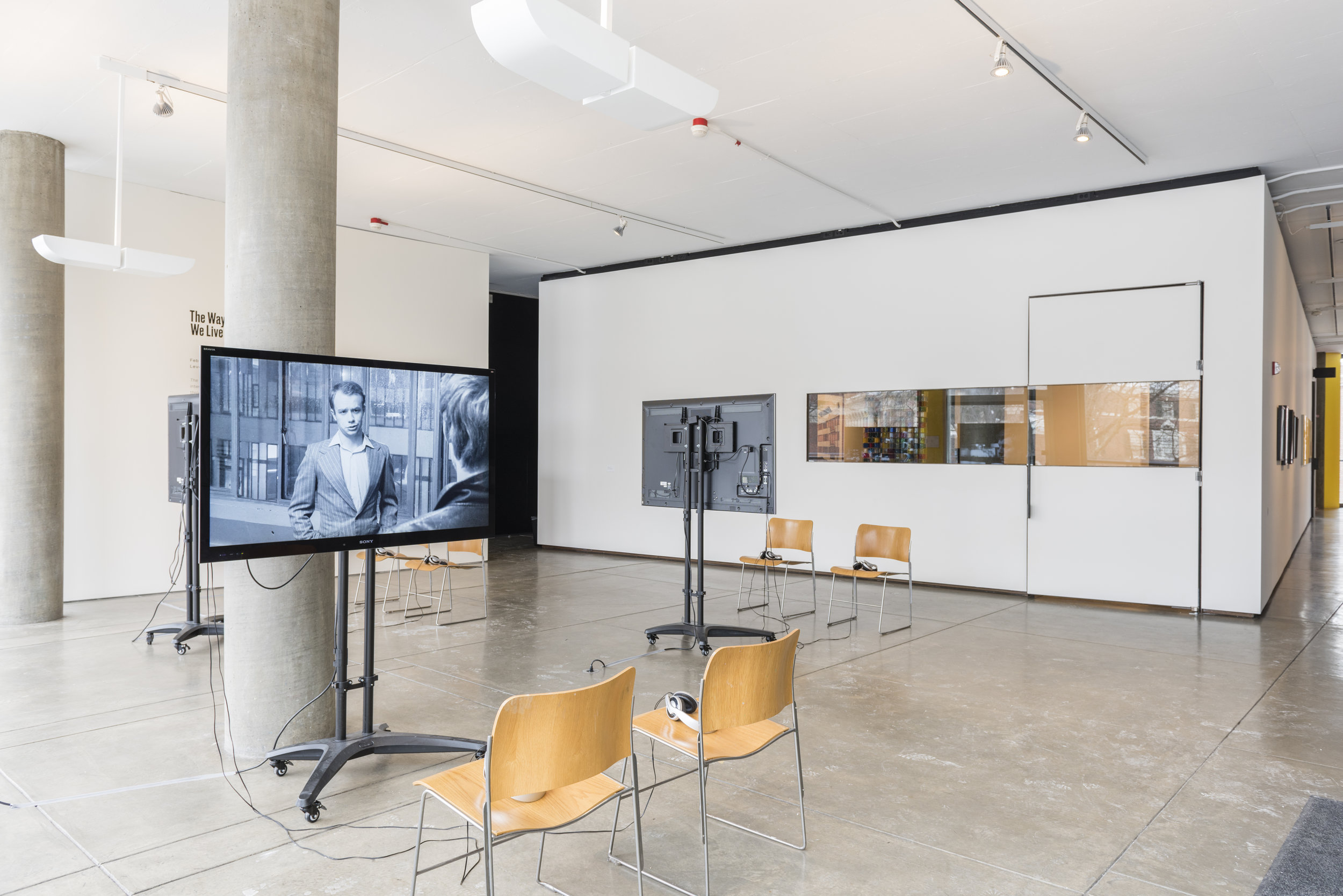  Gerard Byrne,&nbsp; Subject , 2009, installation view, three-channel video shown on monitors and vinyl wall text. 27 × 32 feet. Commissioned by the Henry Moore Institute, Leeds, England. Courtesy the artist and Green on Red Gallery, Dublin. 