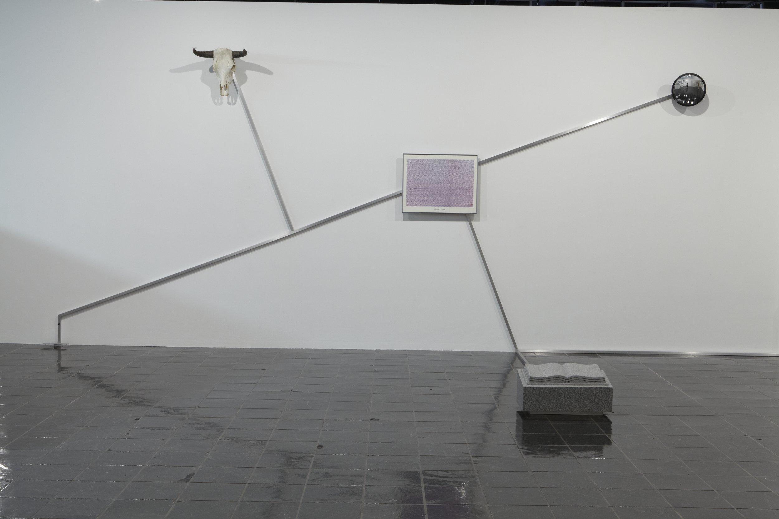  Robert Buck,&nbsp; Constellation ("To find the Western Path, Right thro the Gates of Wrath") , 2008, steel railing and artifacts (headstone, surveillance mirror, steer skull, 3D print, Tumi luggage bag, and barricade),&nbsp;112 x 373 x 110 inches. C