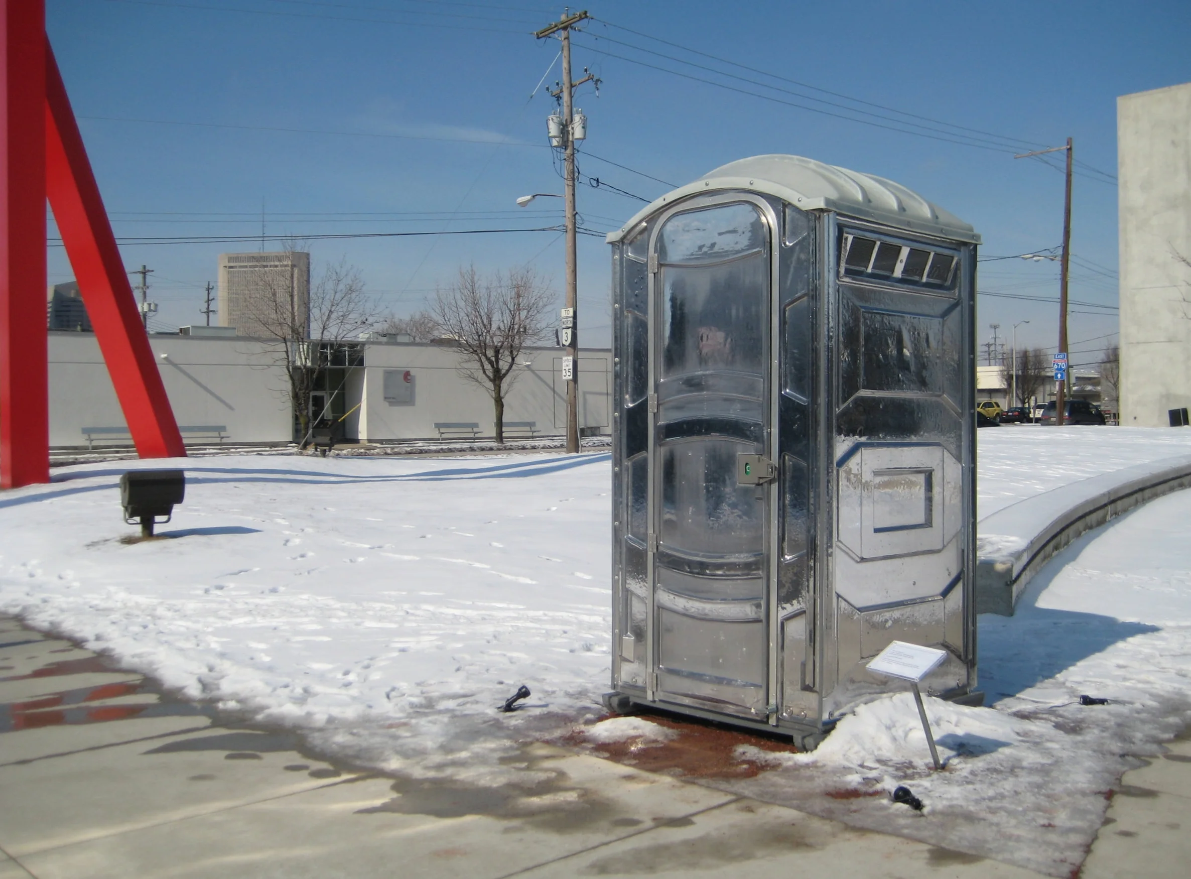 Patrick Killoran, Glass Outhouse , 2002-ongoing; unlimited edition of port-a-potty, 91 x 43.5 x 47 inches; courtesy of the artist