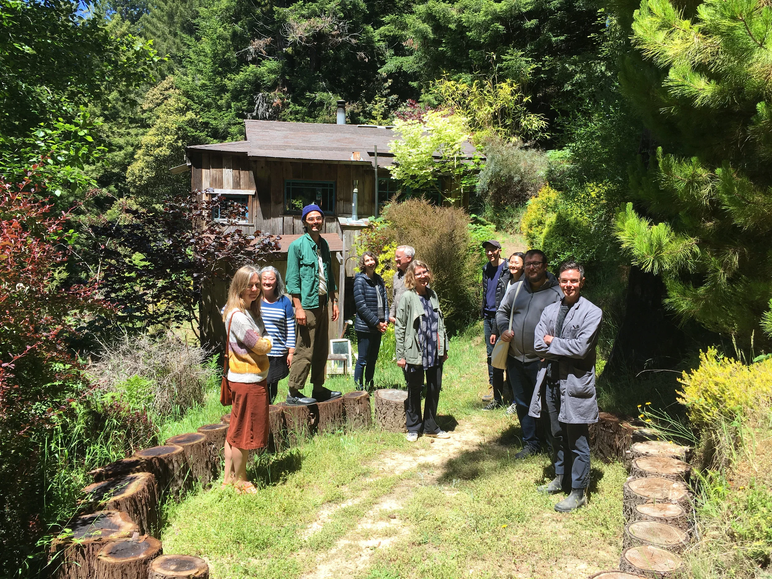 The crew of&nbsp; Companion Planting during a walk around the land, June 8, 2018 