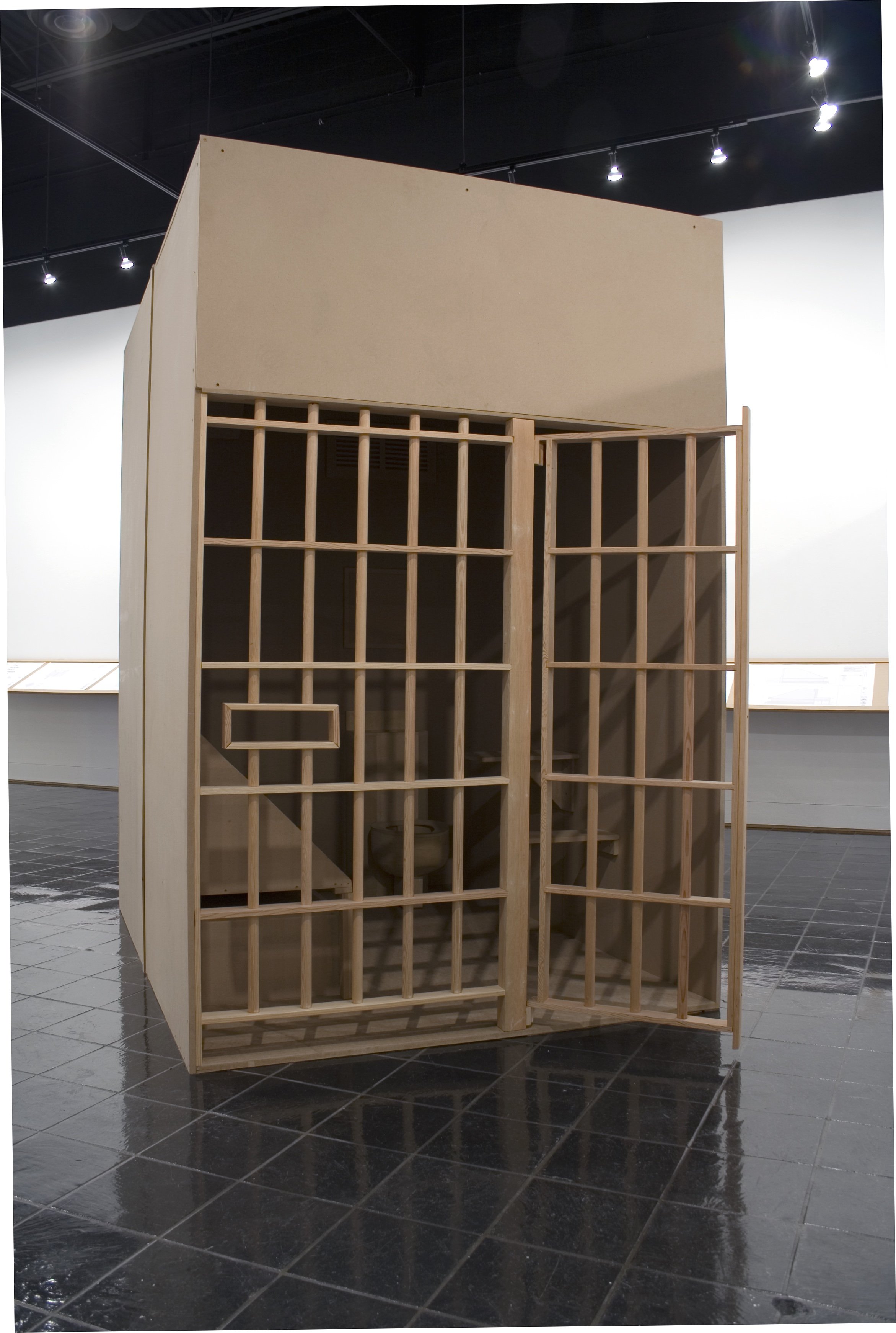  Jackie Sumell and Herman Wallace,  The House That Herman Built , 2002–ongoing, wood installation replica of 6-by-9-foot cell, print documentation, video with sound, posters, publication, and blueprints. Courtesy of the artists. 