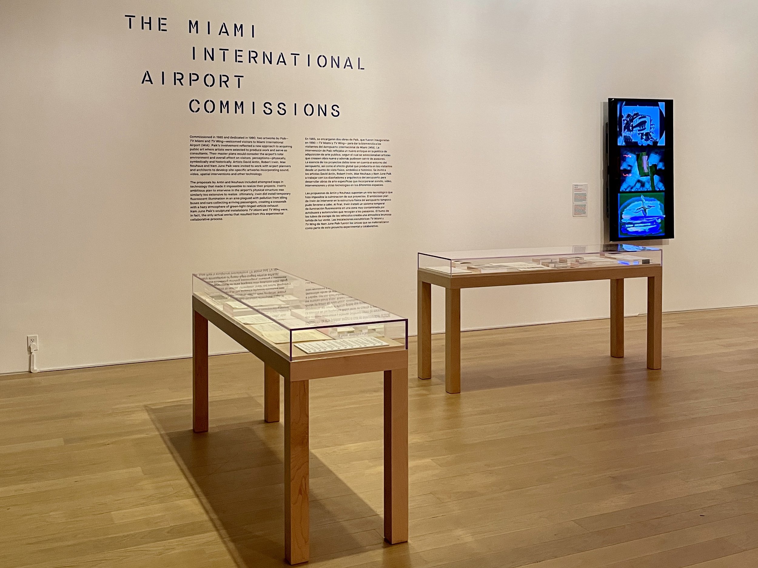  Installation view, archival materials related to Paik’s  TV Miami  and  TV Wing , commissioned by Miami-Dade County Art in Public Places Trust in 1985. Right, video footage from the original artworks, 1990. Three channels of analog standard definiti