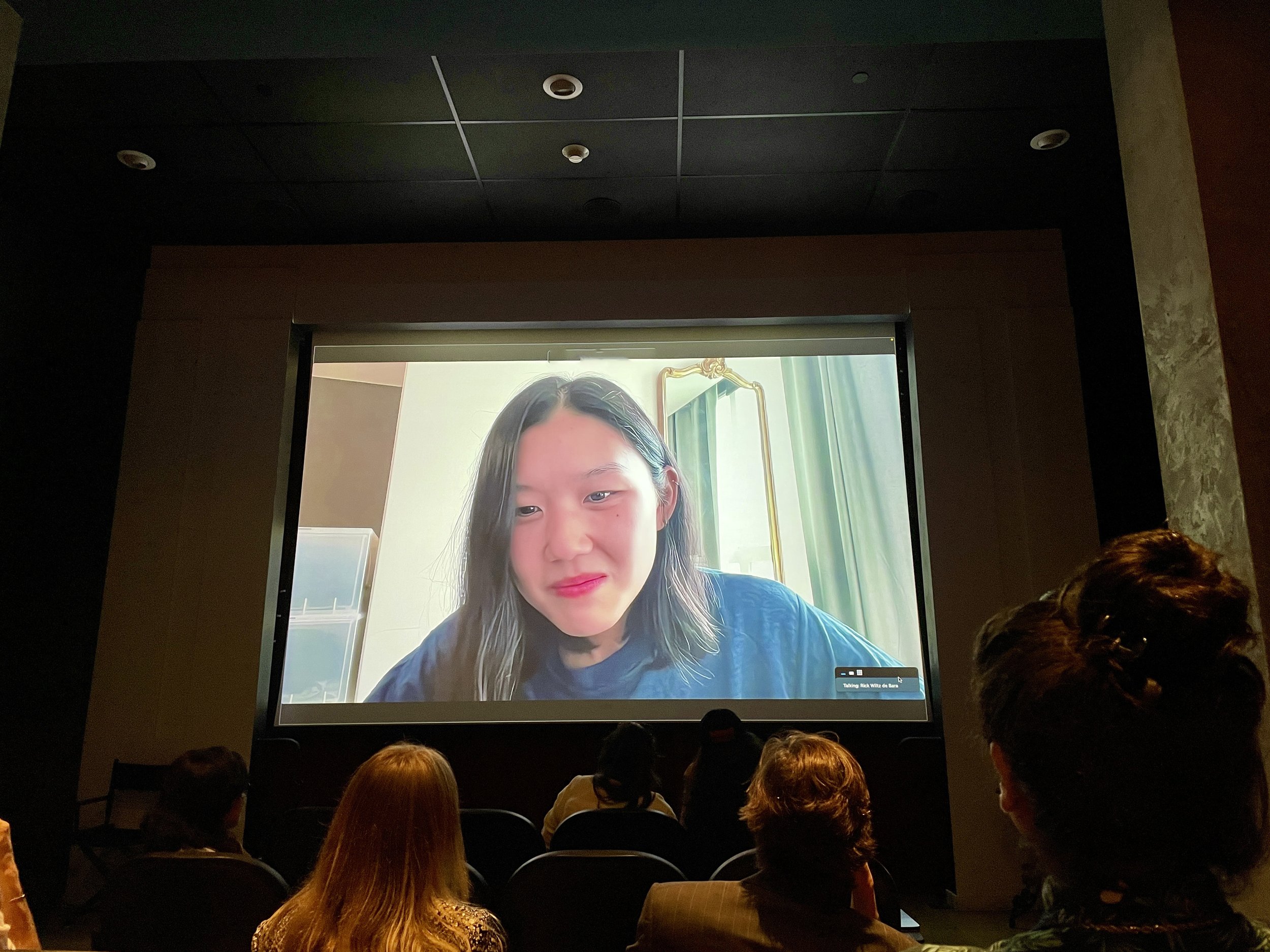  Amanda Kim, director of  Nam June Paik: Moon Is the Oldest TV , 2023, live video program following screening of  film, O Cinema, Miami Beach, October 6, 2023.  