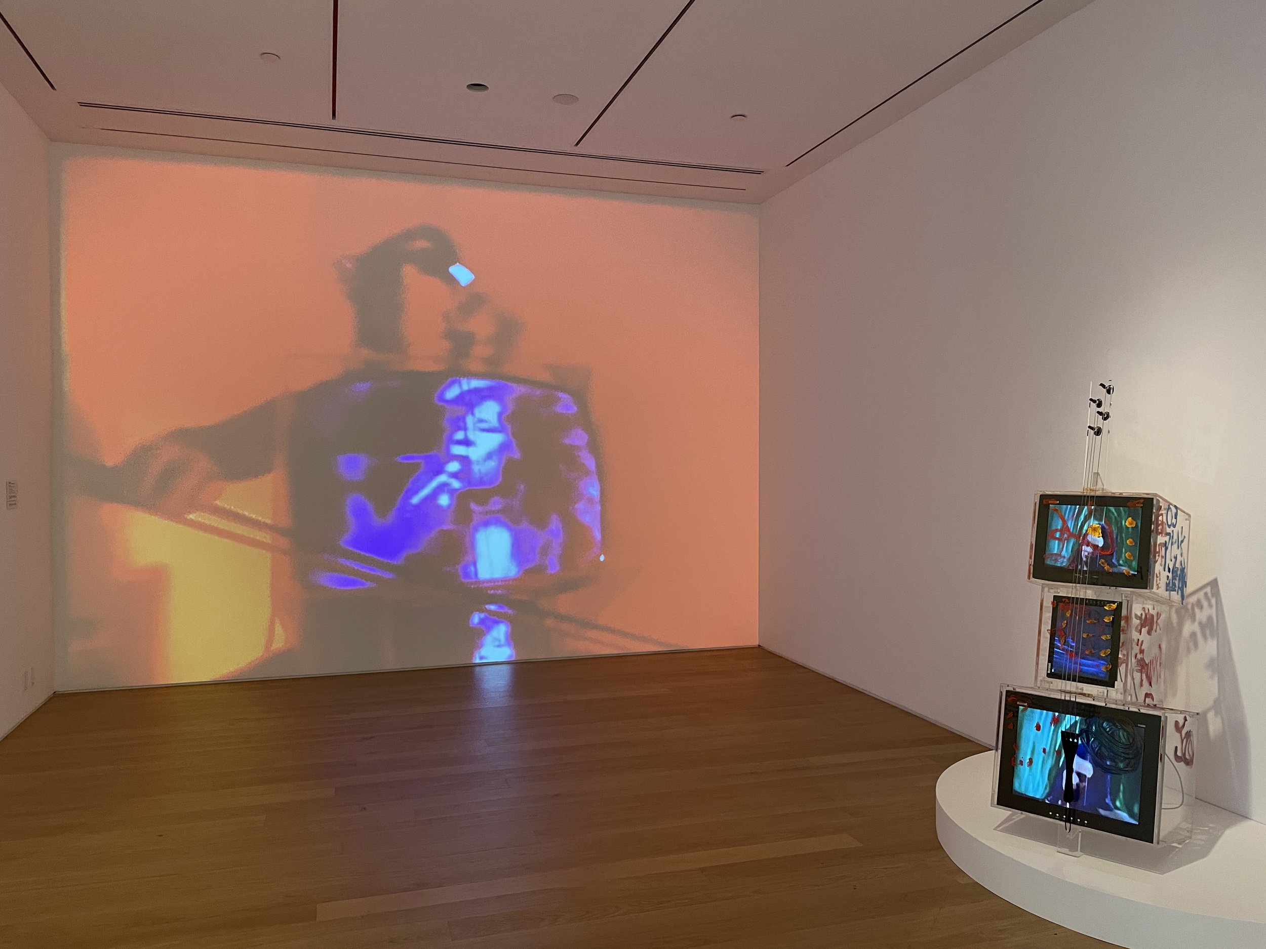  Installation view, Nam June Paik and Jud Yalkut,  TV Cello Premiere , 1971, 16 mm film (on video), color, silent, 7:25 min. Courtesy of Electronic Arts Intermix (EAI), New York; Nam June Paik,  TV Cello , 2003, single-channel video (color, sound), L
