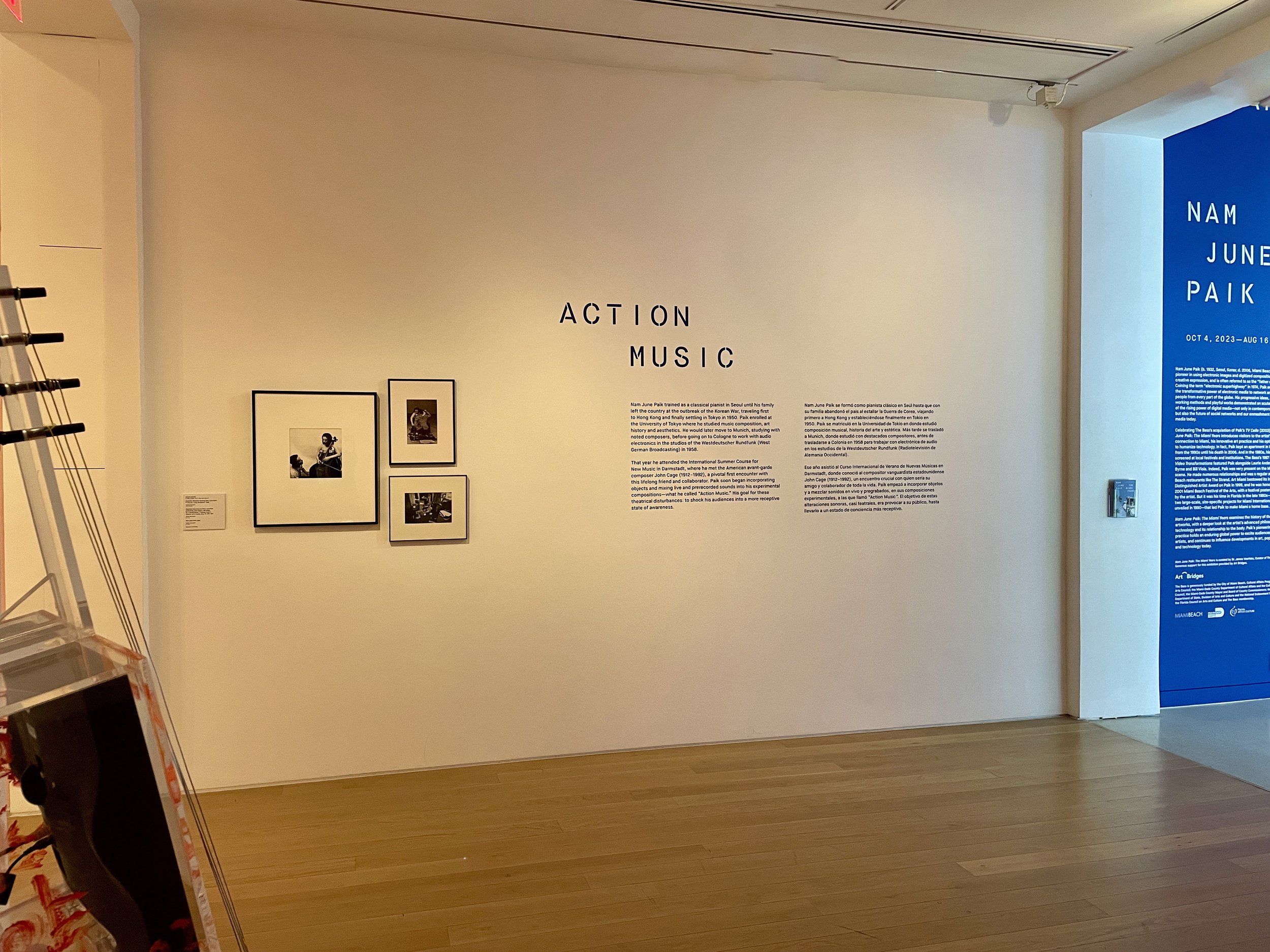  Installation view, introduction to Paik’s  TV Cello , 2003 with photographs of Charlotte Moorman and Paik taken by Peter Moore in the late 1960s and early 70s. 