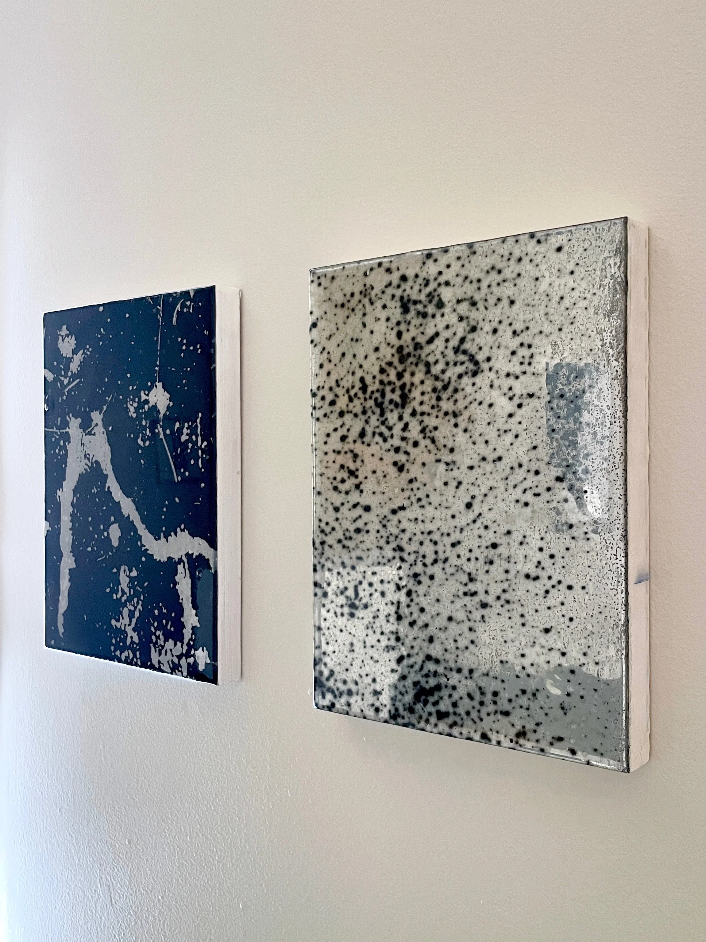   10 by 8 (flake.verso) , 2024. Reflective polyester film, urethane resin and mixed media on wood panel, 10 × 8 × 7/8 in.;  10 by 8 (wall #5) , 2024. Reflective polyester film, acrylic, urethane resin and mixed media on wood panel, 10 × 8 × 7/8 in. 