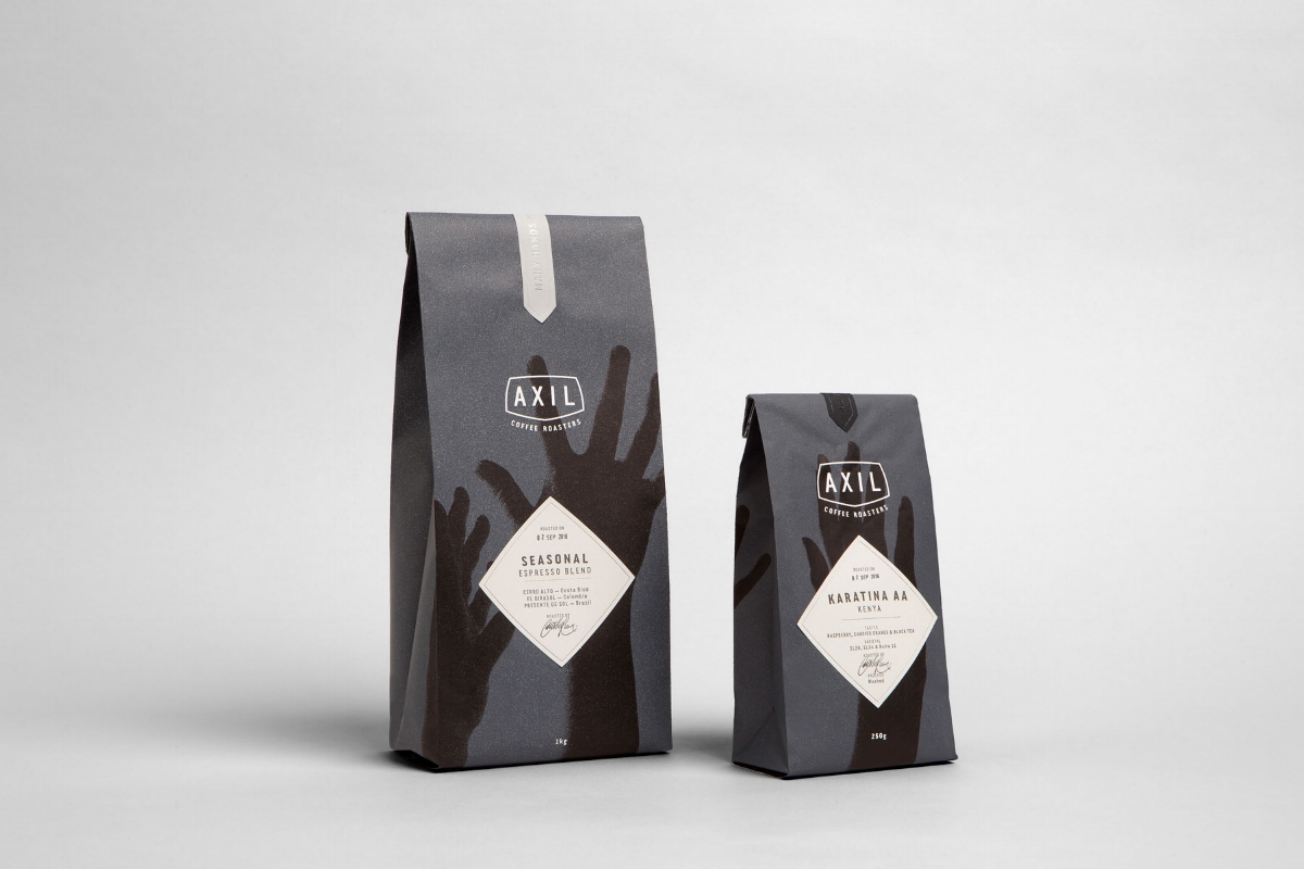 Working alongside Axil Coffee Roasters, we crafted a new identity for the business that is authentic in its actions and humble in its tone. Echoing the theme ‘Many Hands Make Light Work’ we created tactile coffee packaging, signage, menus, coffee cu