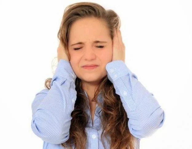 tinnitus_woman_holding_ears_cropped.jpg