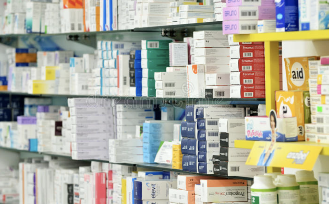 Pharmacy shelf stocked with medicine