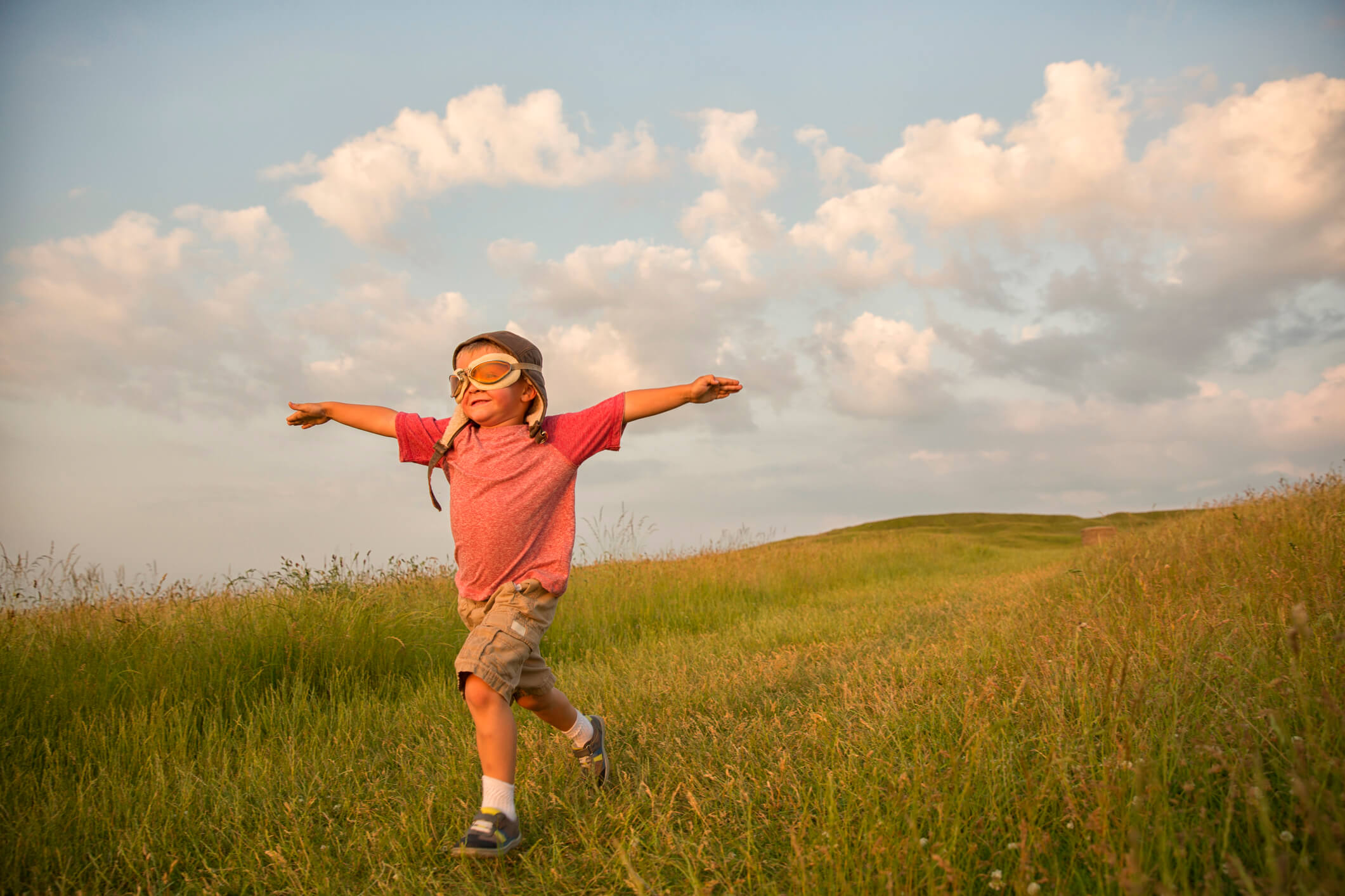 Young-English-Boy-Imagines-Flying-on-Hill-481258993_2125x1416.jpeg
