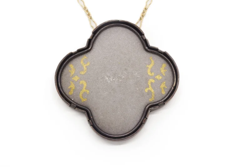 Cement Quatrefoil , copper, enamel, 24k gold foil, 24k gold filled chain, 2” x 2” (24” chain), 2015 (photo by artist)