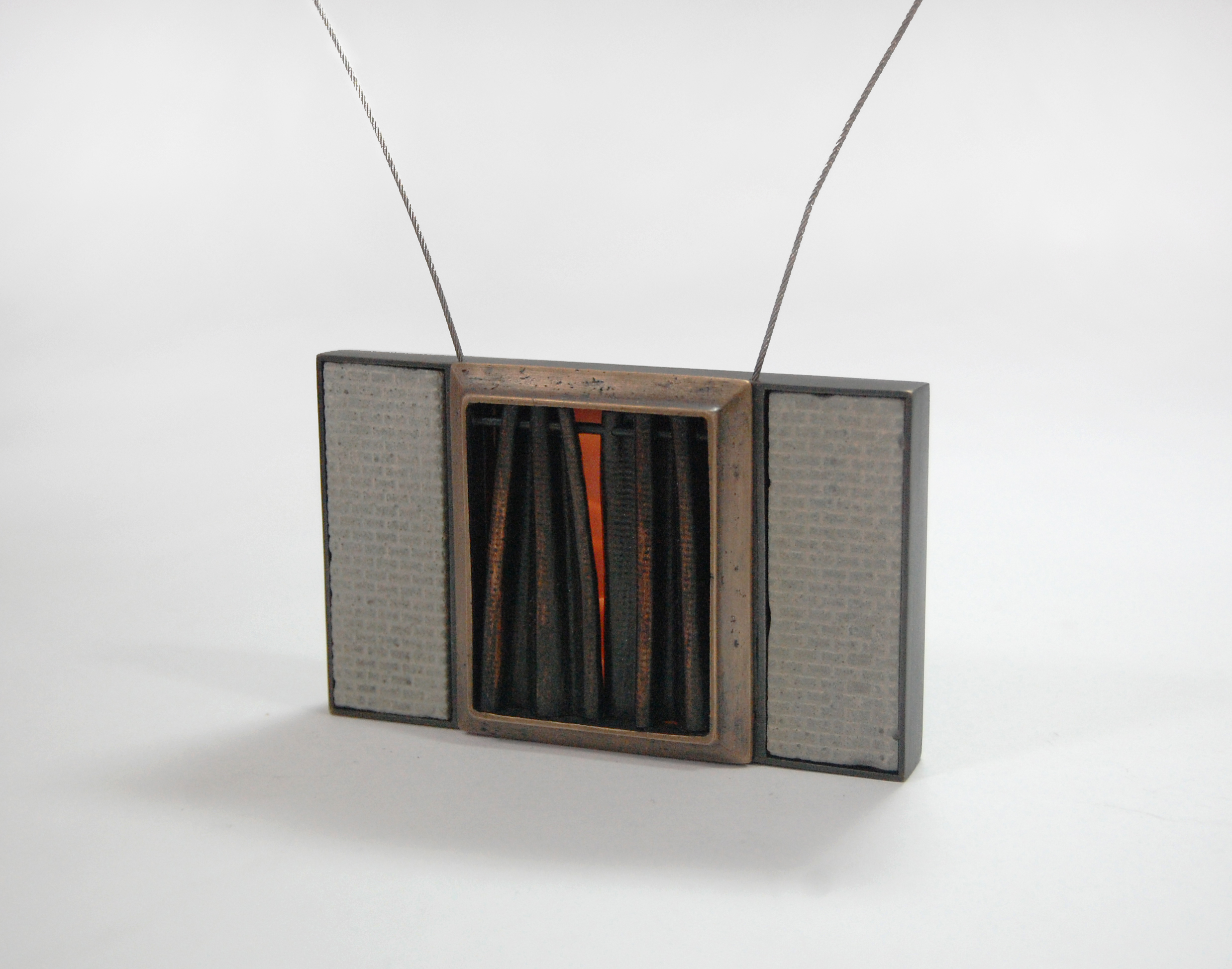 Figure 10: Cedarhurst, cast bronze, nugold, copper, steel cable, concrete, silicone, 3 1/2” x 2 1/4” x 3/4”
