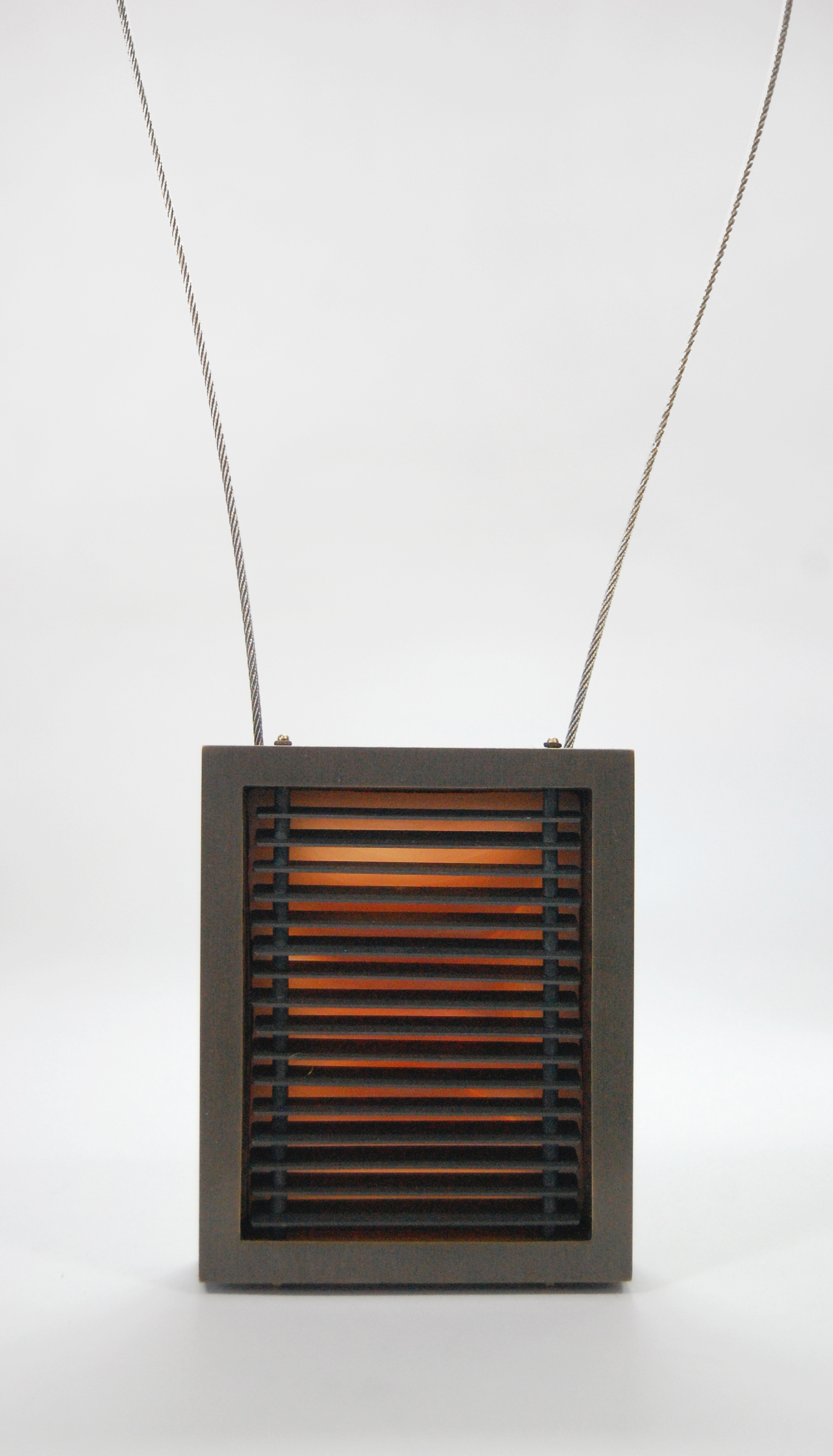 Figure 15: Newland, nugold, copper, steel cable, silicone, 3 5/8” x 3” x 7/8”