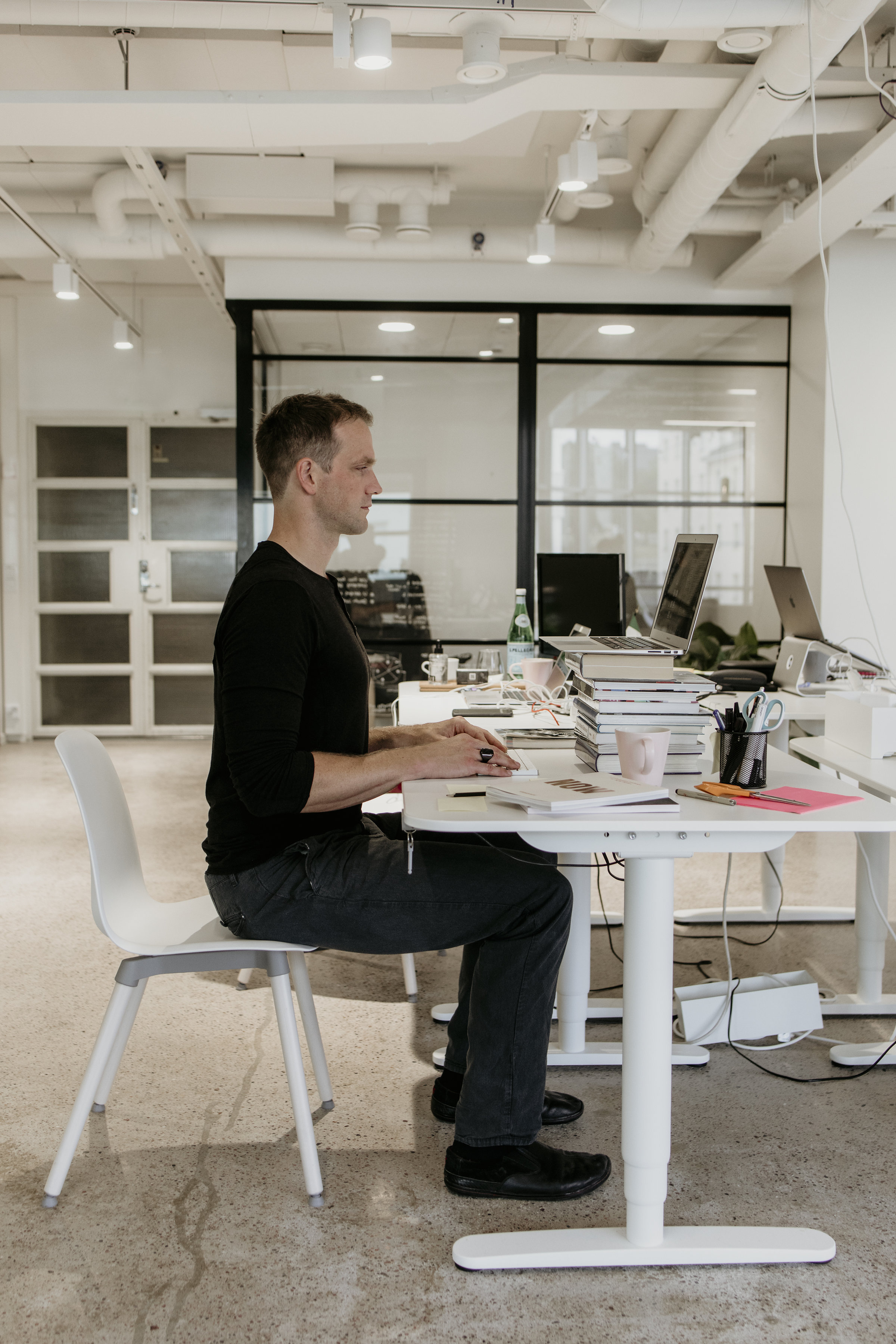 Sitting on the edge of a chair - this will force you to sit in a better position.