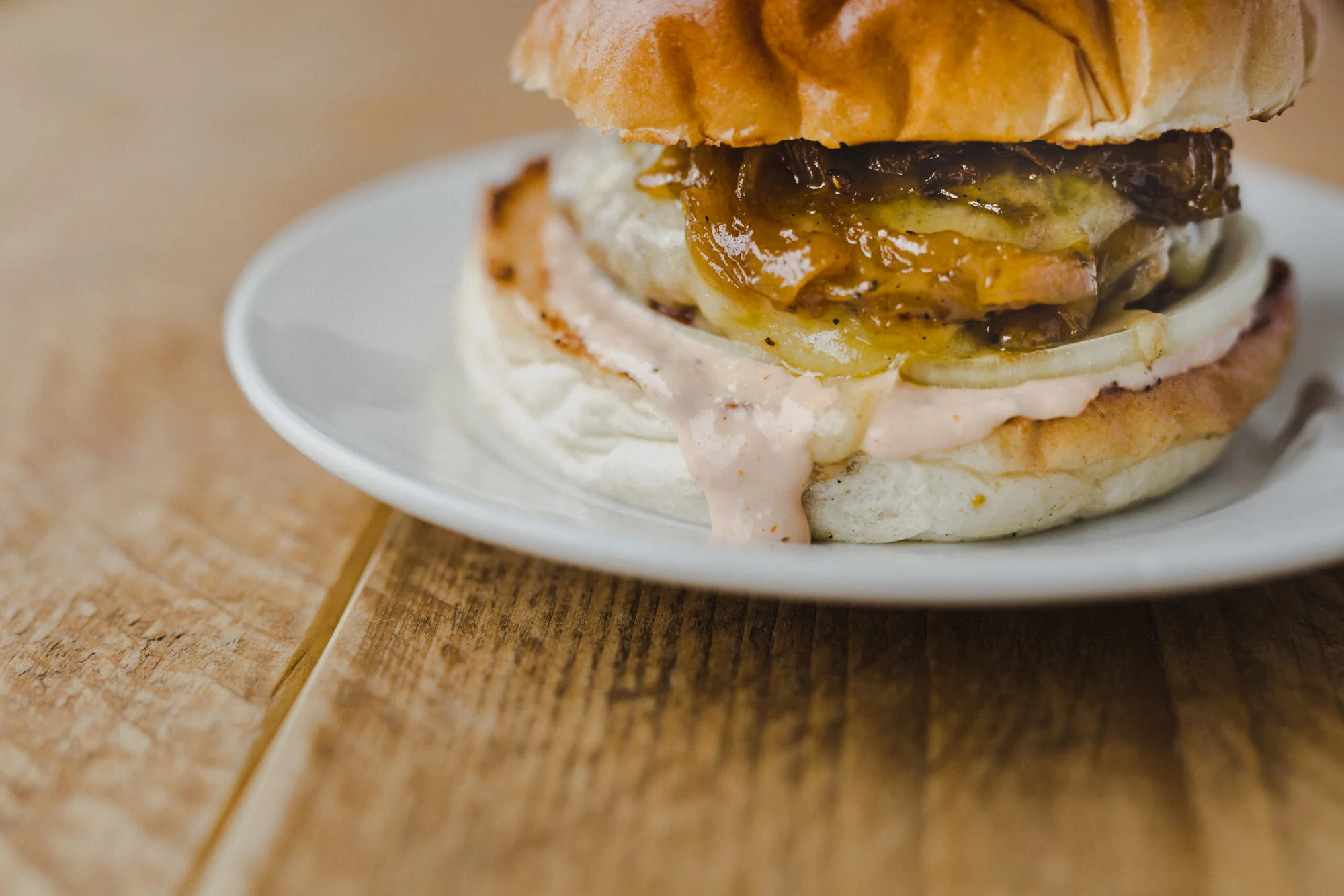 Smashin Burger: mustard-rubbed patty smashed onto the griddle, topped with sautéed onions and Monterey Jack cheese.