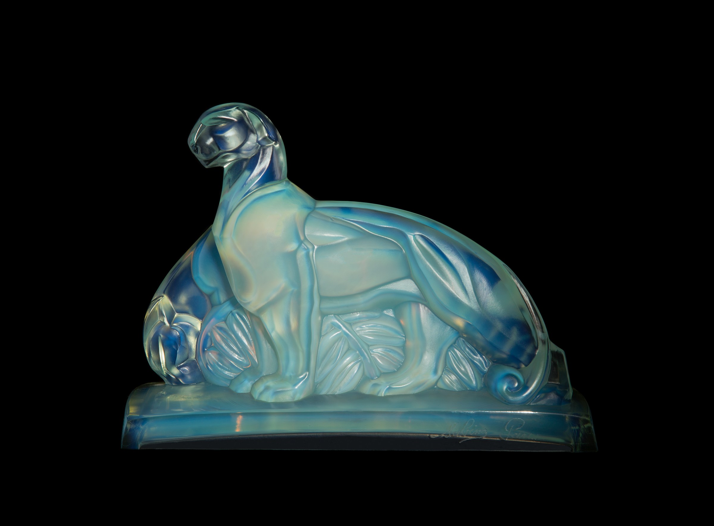  Marius-Ernest Sabino (French, 1878–1961).  Groupe de Pantheres (Group of Panthers),  circa 1928-1938. Press-molded opal glass; 5 3/4 x 8 x 3 in. Collection of David Huchthausen. Photo by Llyod Shugart. 