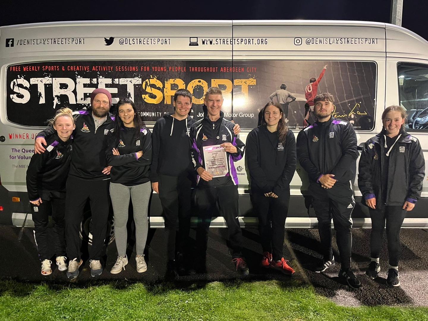 Dave Thompson (Centre) receiving his 300 hours volunteering certificate