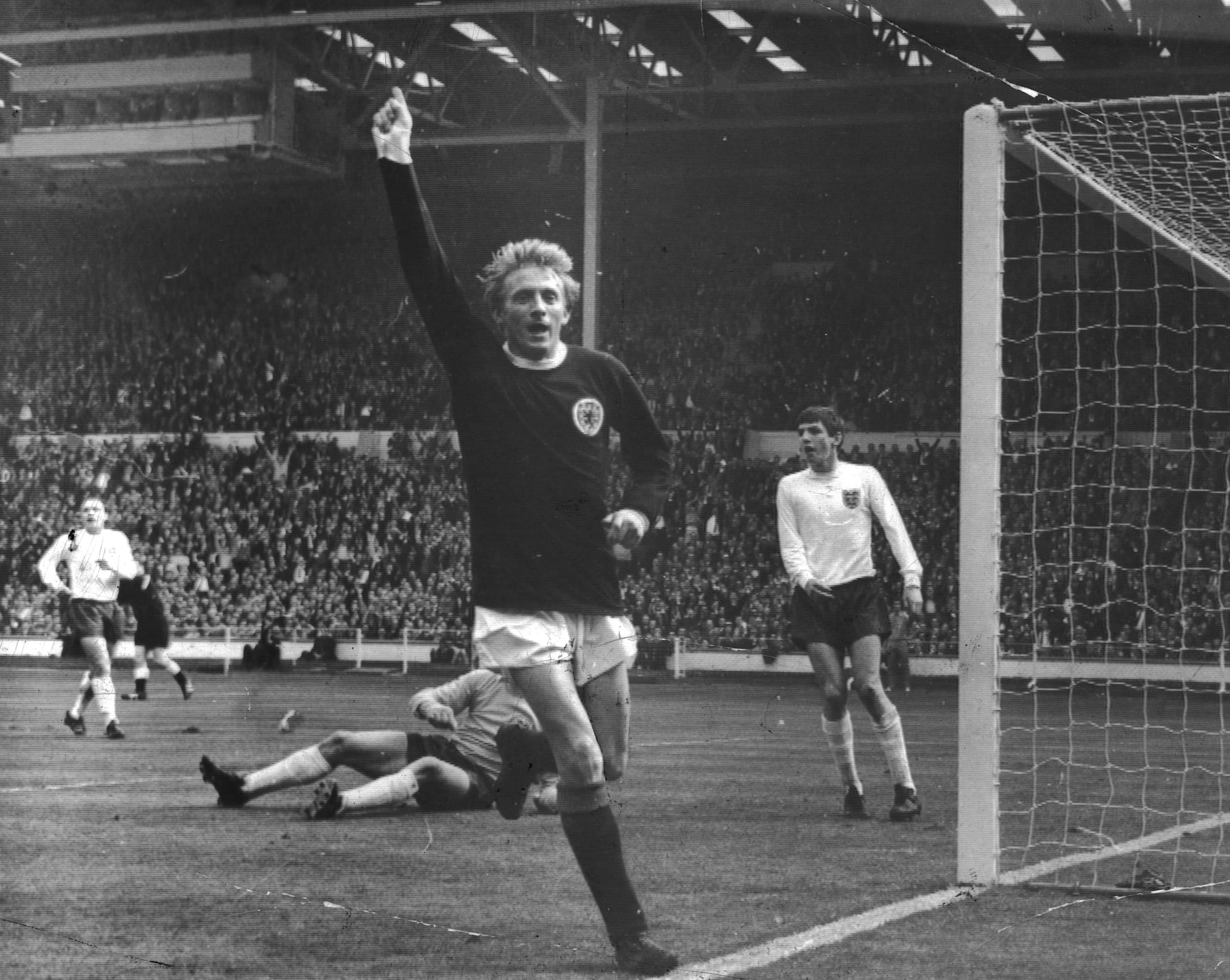 1967 - Denis Law Playing vs England.png