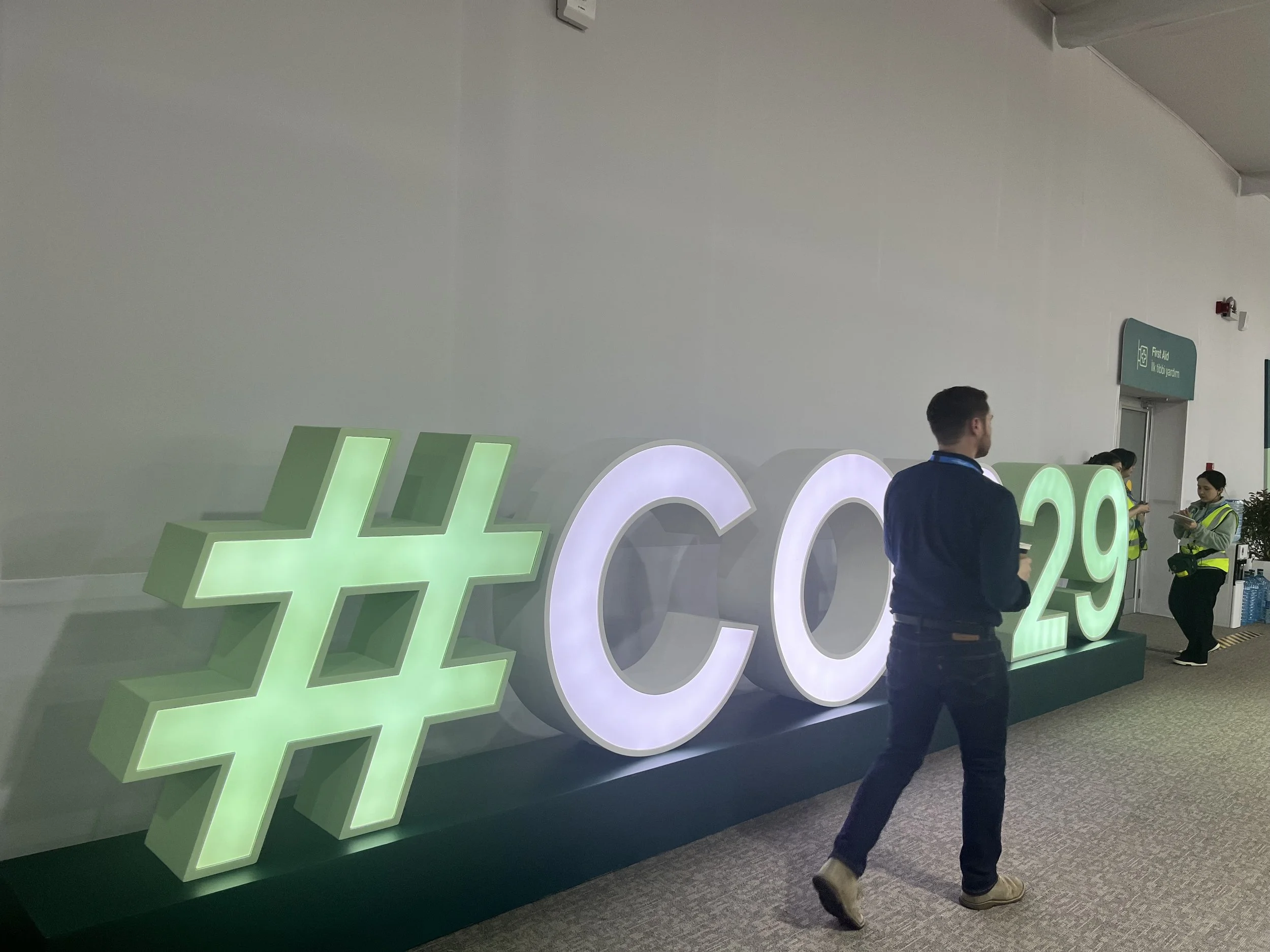 Ryan Driskell Tate, walking at COP 29