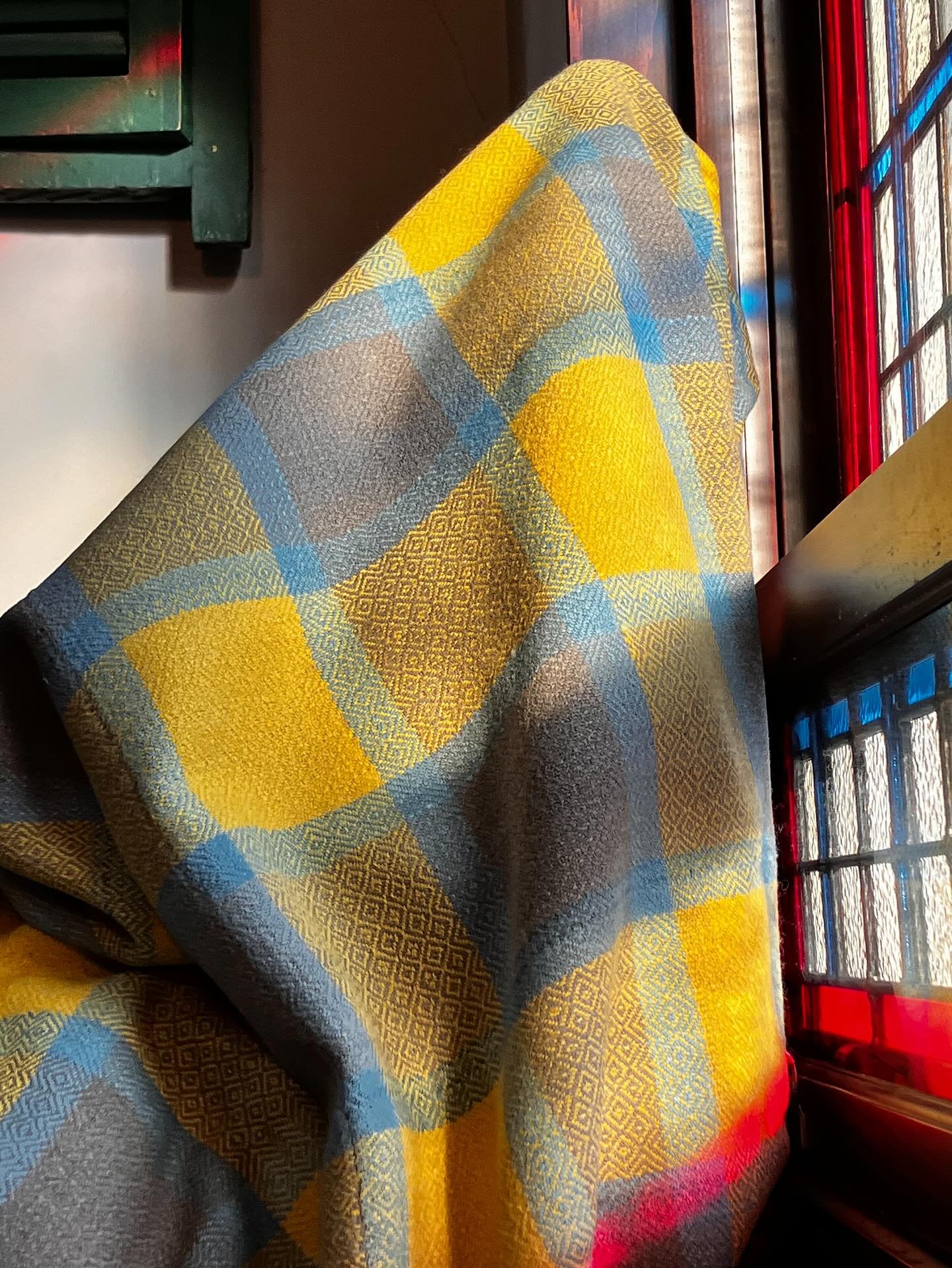 It&rsquo;s such a joy to see parallels between objects in the visual arts. In this case, a blanket and a stained glass window. 
When I took this goose eye blanket off the loom, I was struck with its similarity to a window in our house. The play of li