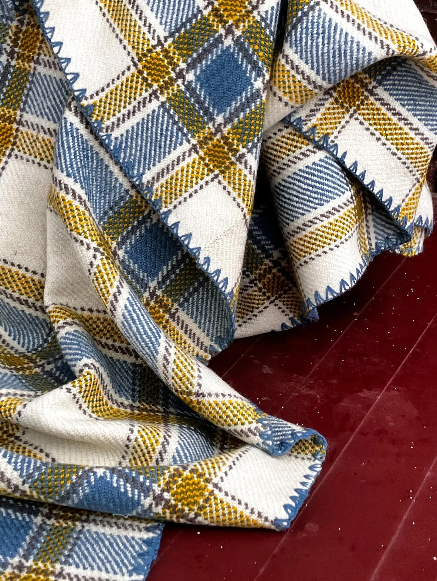 The Cottage Blanket

Beautiful and soft Norbouillet wool from Peterborough County.
The naturally dyed colours tell the story: indigo blue sky and water, goldenrod yellow sun, indigo and goldenrod green trees and undyed brown sandy beach. Gorgeous col