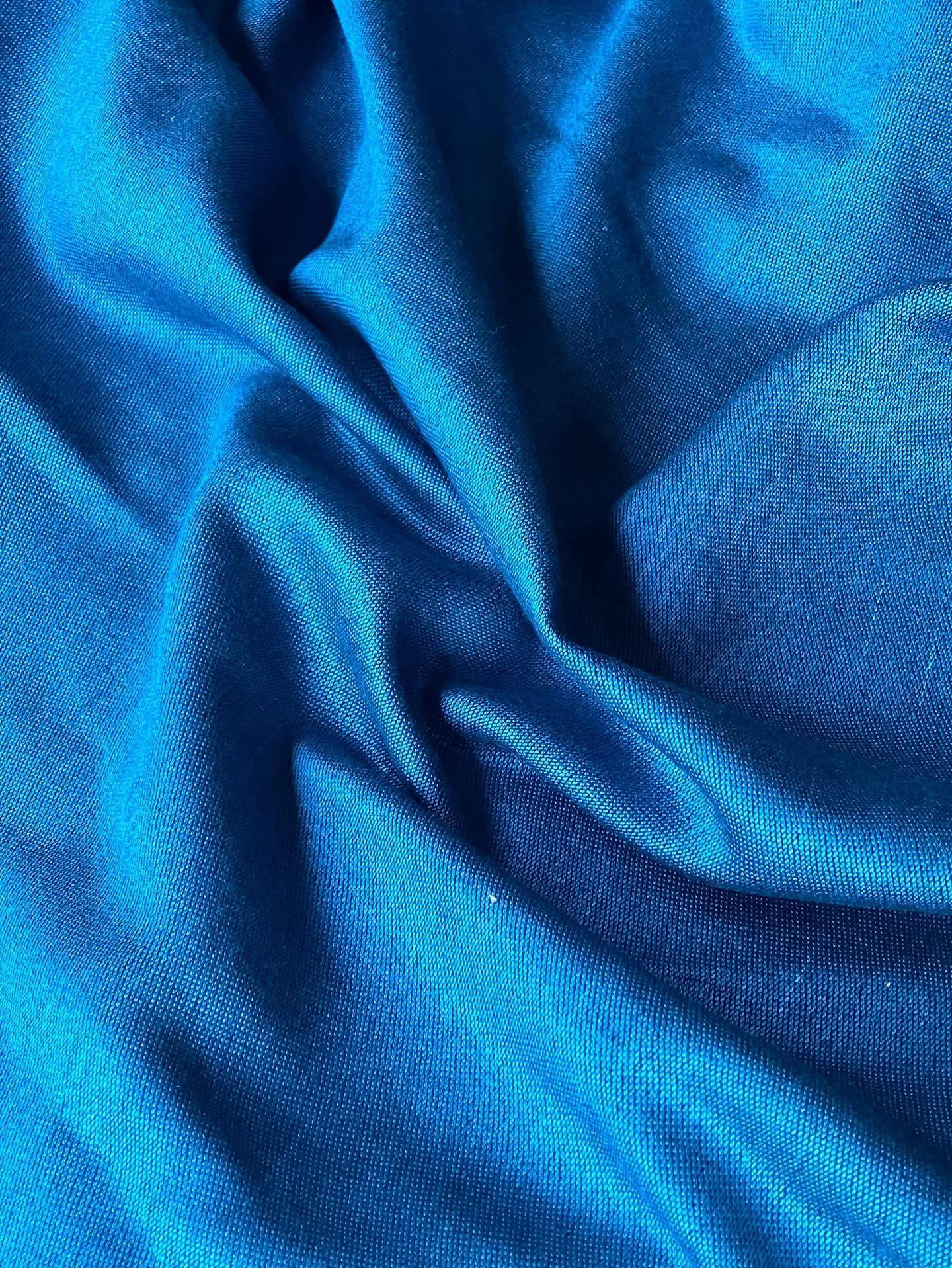 Custom woven and dyed silk fabric in a satin weave.
The silk warp was dyed by @ironcauldron.ca in a gorgeous aqua blue. The weft is a fine black wool which added extra luminance to the silk.