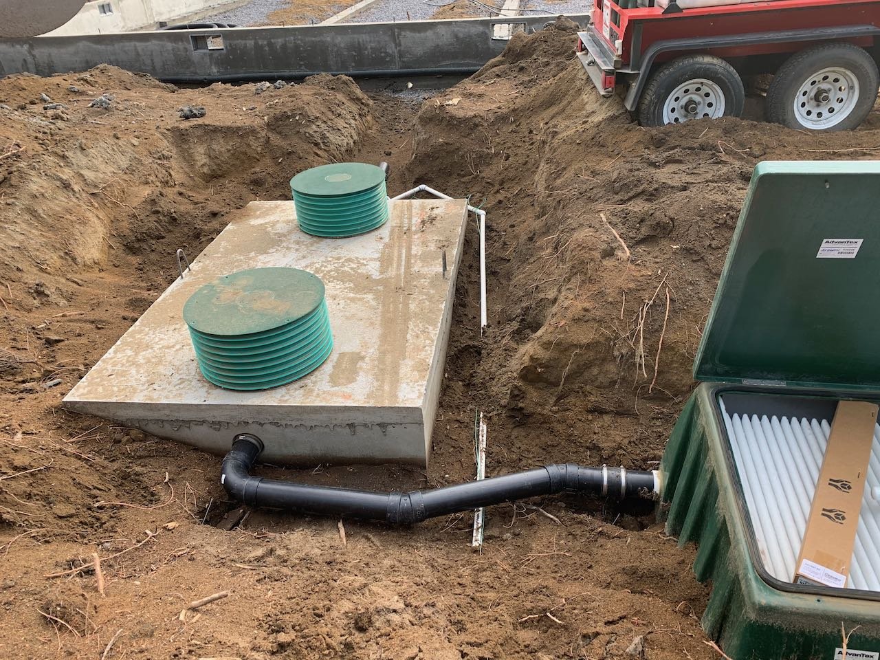 Advanced Treatment Technology Unit connected to concrete septic tank