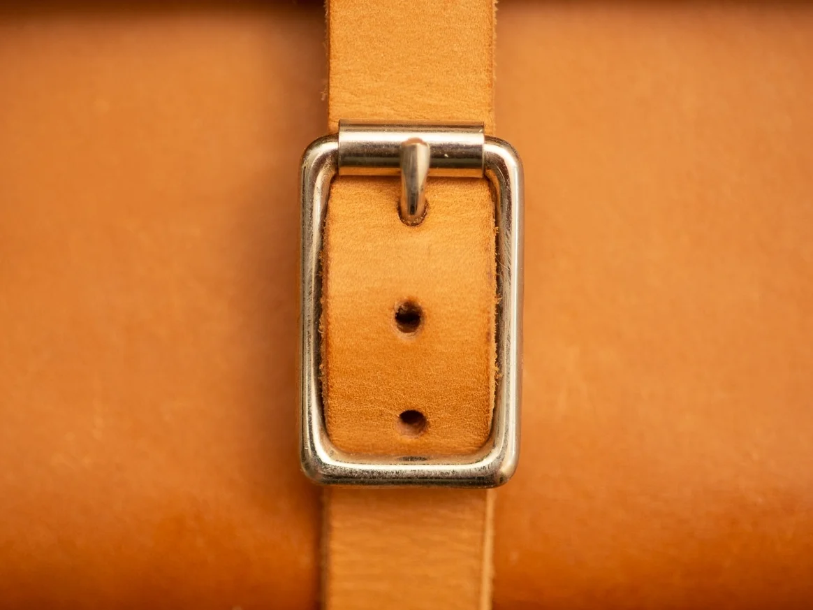 New square buckle with roller bar to eliminate friction.