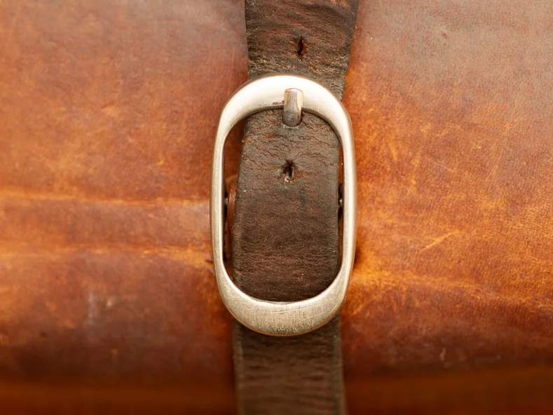 5 years of wear and tear from the old buckle.