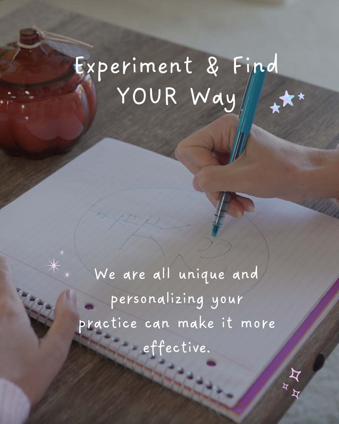 Hand sketching Reiki symbols in a spiral notebook next to a pumpkin candle, illustrating the lesson to experiment and find your own style for your Reiki practice