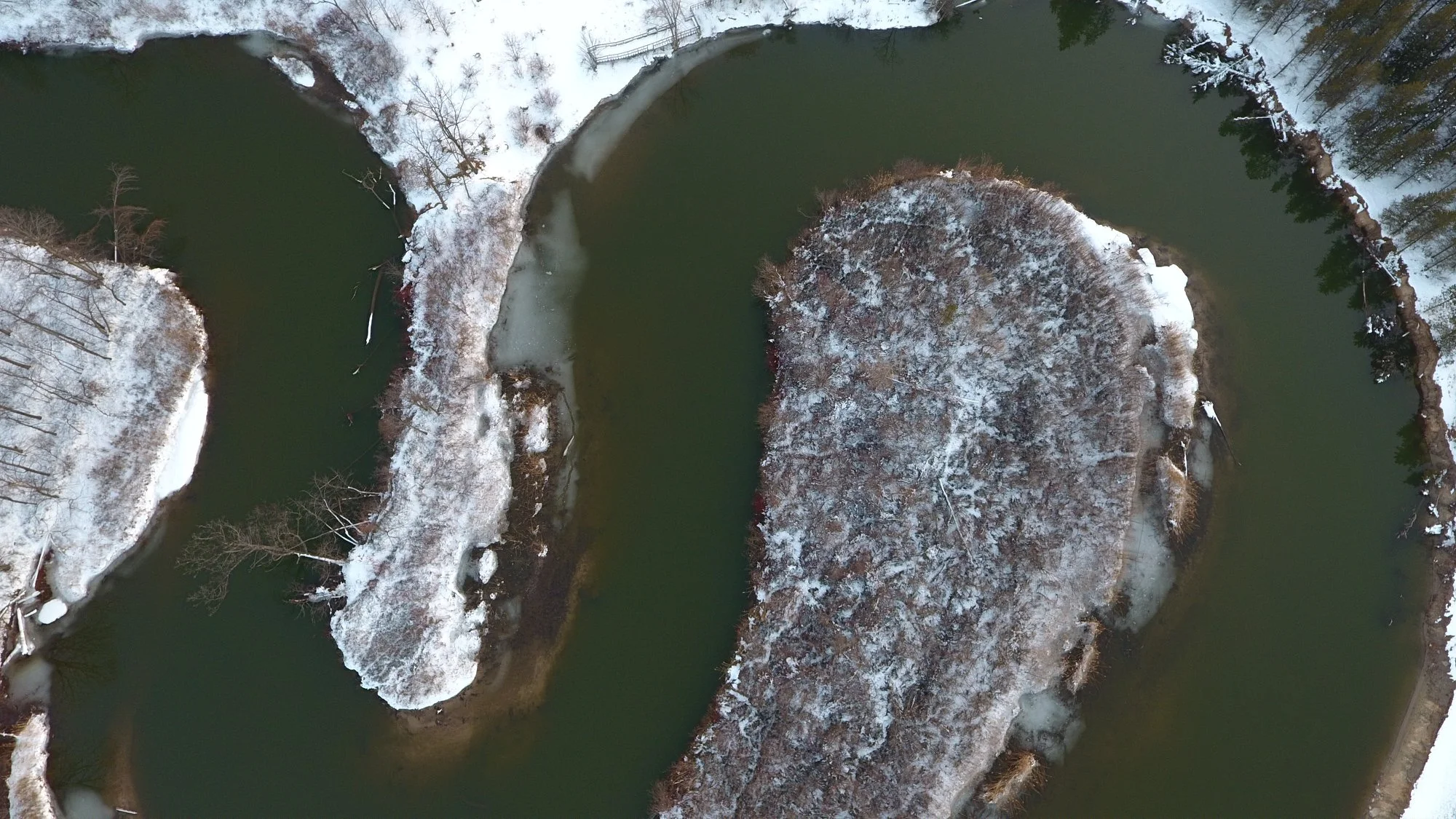Snow on the shores of the Pinnebog River