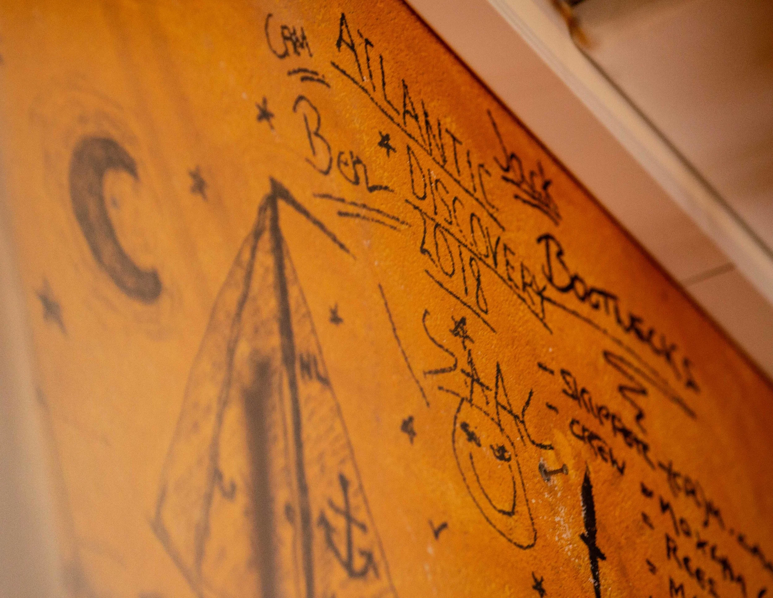 Look out for Atlantic Discovery on the right hand top corner of the taberna as you enter the door.