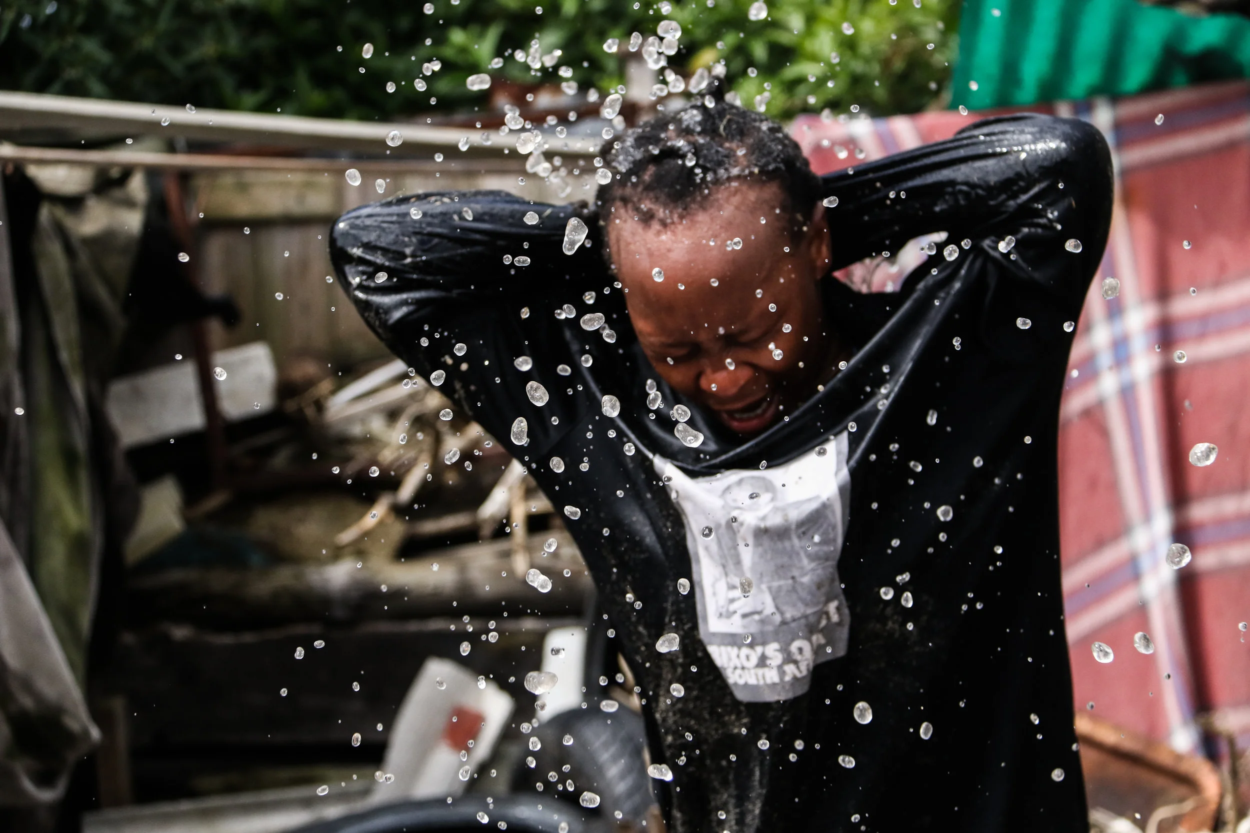 Vathiswa Nodlayiya, a performance artist, rehearses in a backyard in the township of Langa, Cape Town, South Africa 