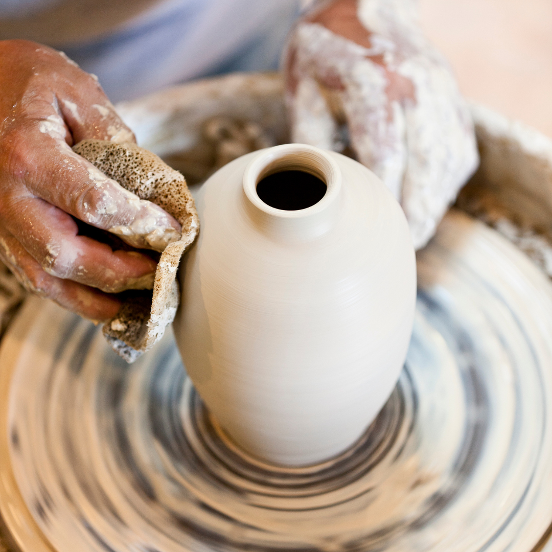  Student throws a vase on a wheel at Norwich Pottery Studio 