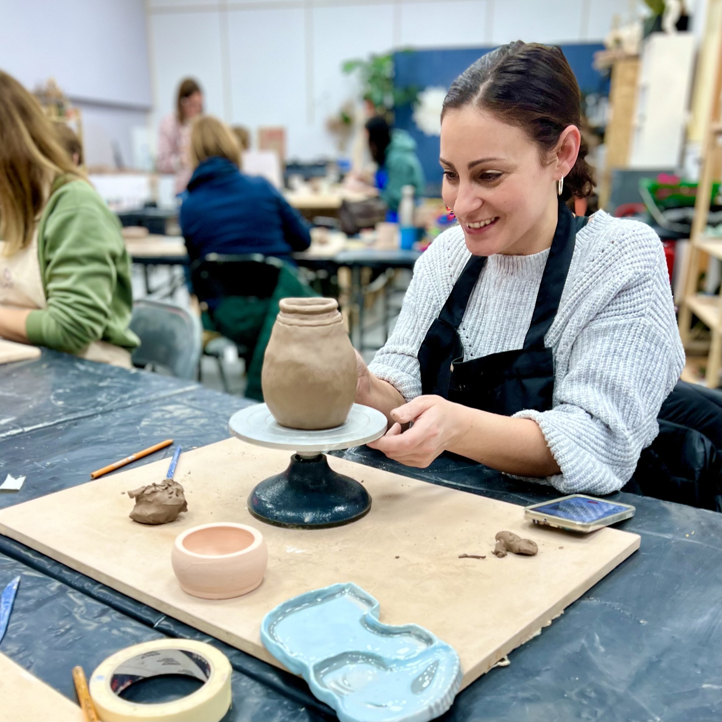  Lady hand builds a vase during a 6 week beginners course at Norwich Pottery Studio 