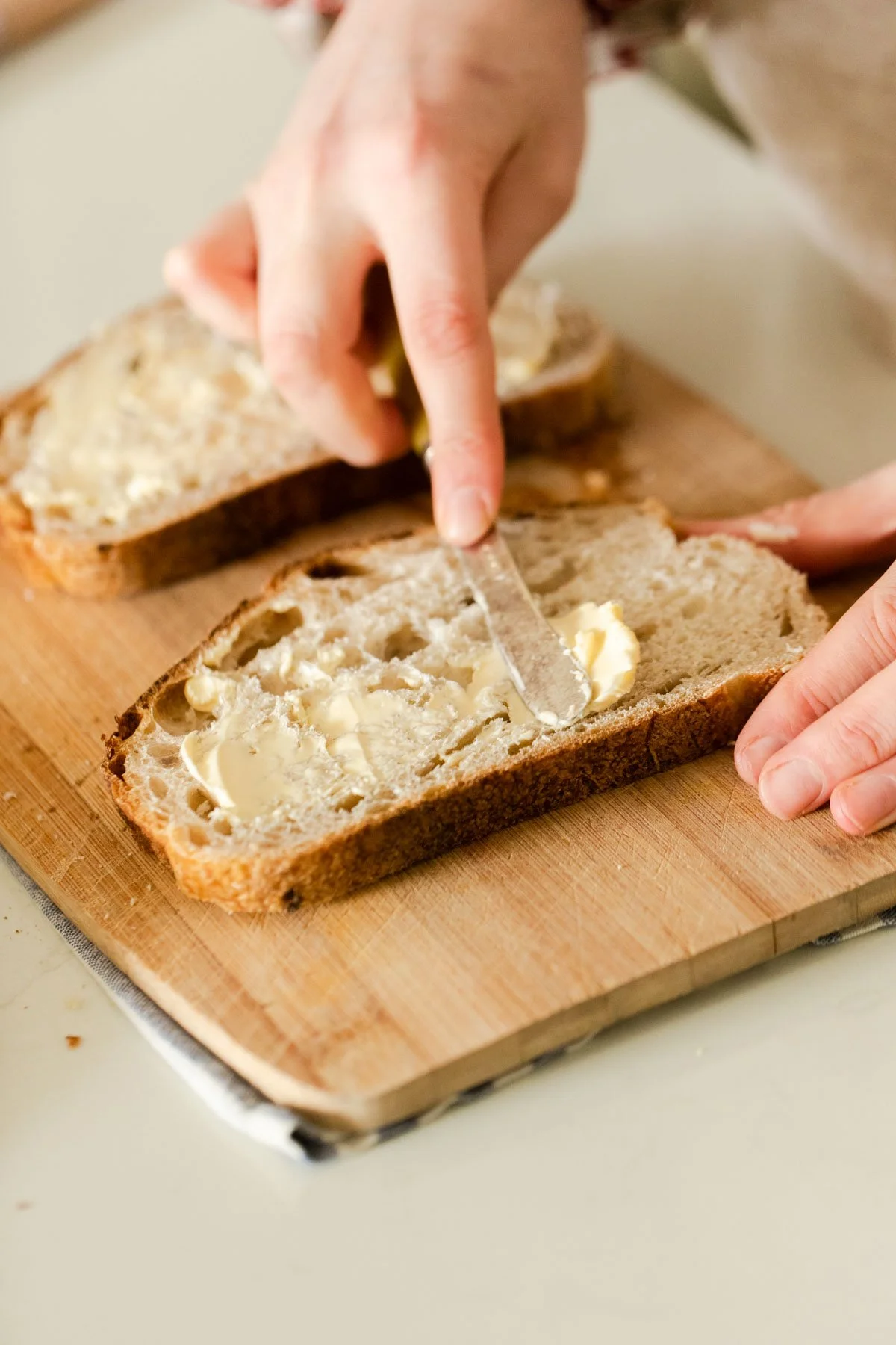Buttering bread with vegan butter Buttering bread with vegan butter