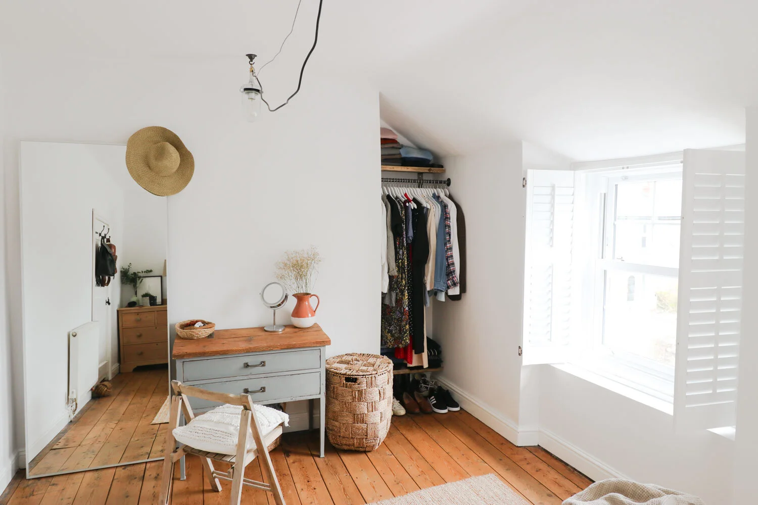 open wardrobe - cottage bedroom makeover