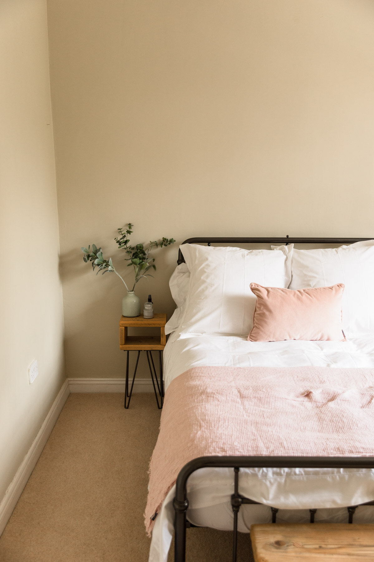 Pink bed covers in country home