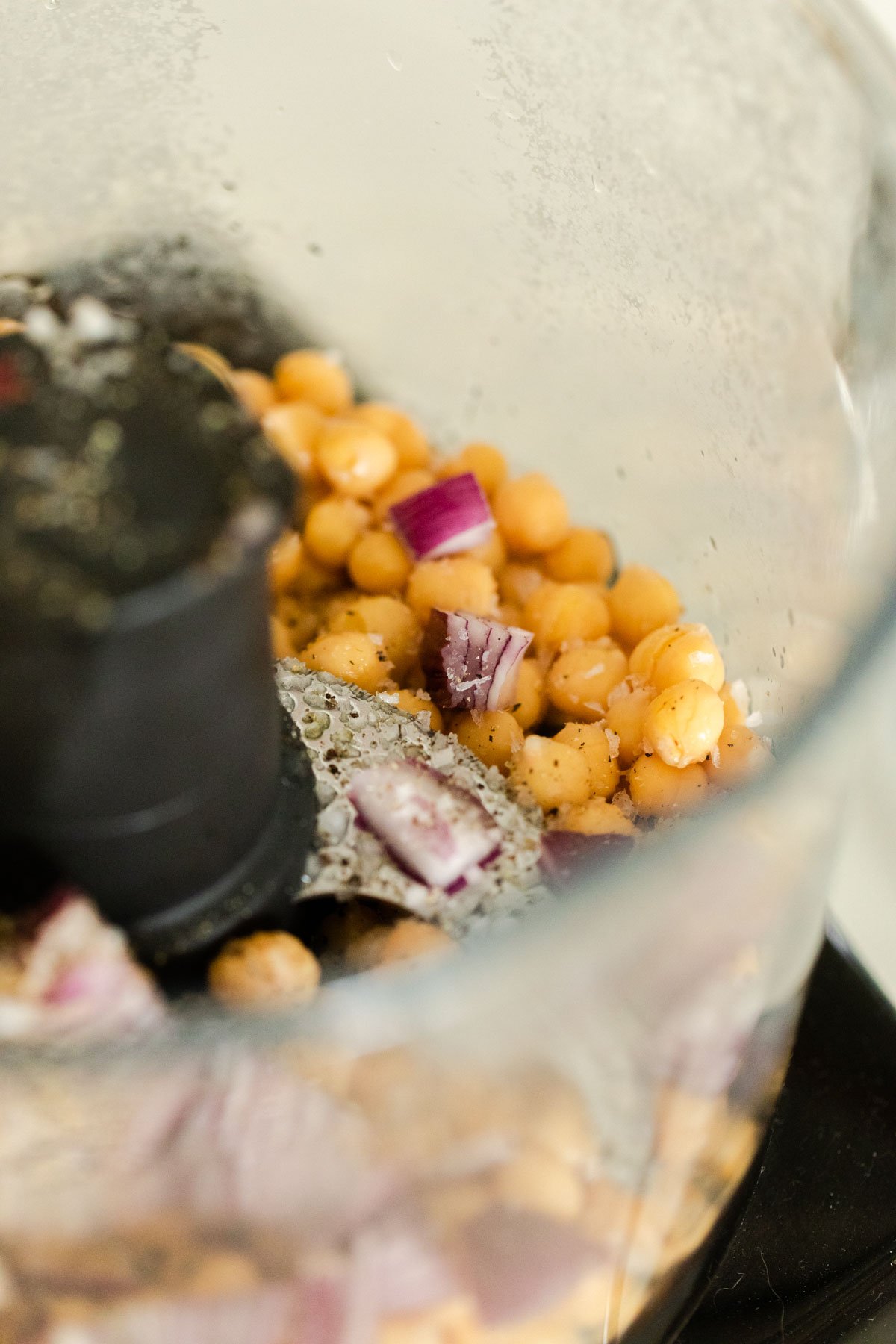Blending chickpeas and red onion Blending chickpeas and red onion
