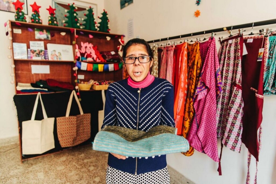 Sandhya, one of the original seven women, showing off her craft