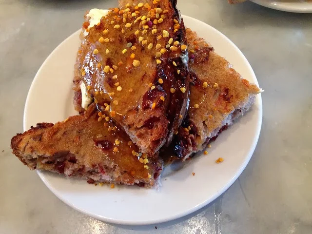 Cranberry-walnut bread with honey and bee pollen.