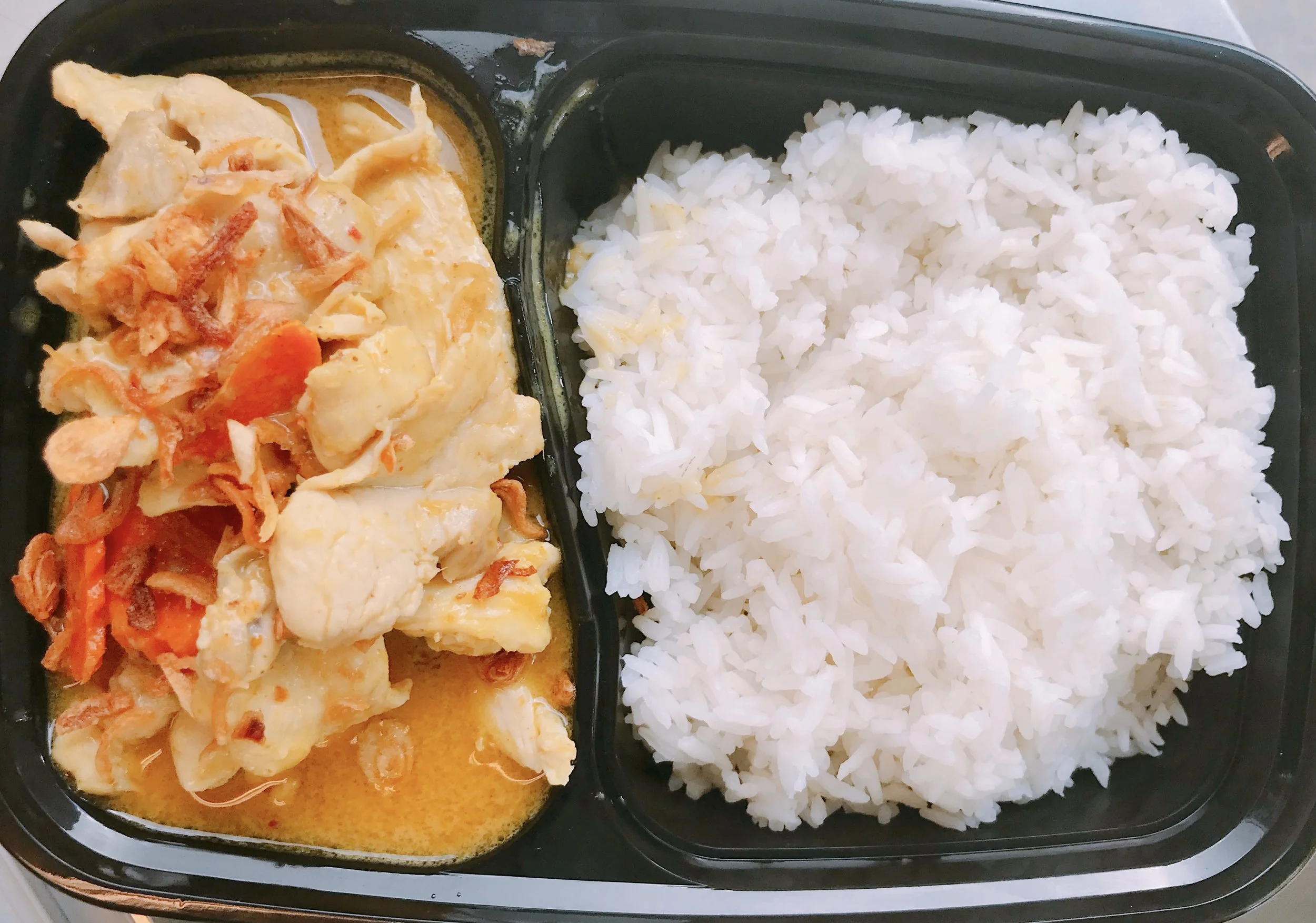 Yellow Curry with chicken or tofu - $10 Ingredients: cumin power, tumeric powder, garlic, coconut milk, tamarind sauce, slow-cooked potatoes, carrots, and onion topped with crispy onion and served with Jasmine rice.