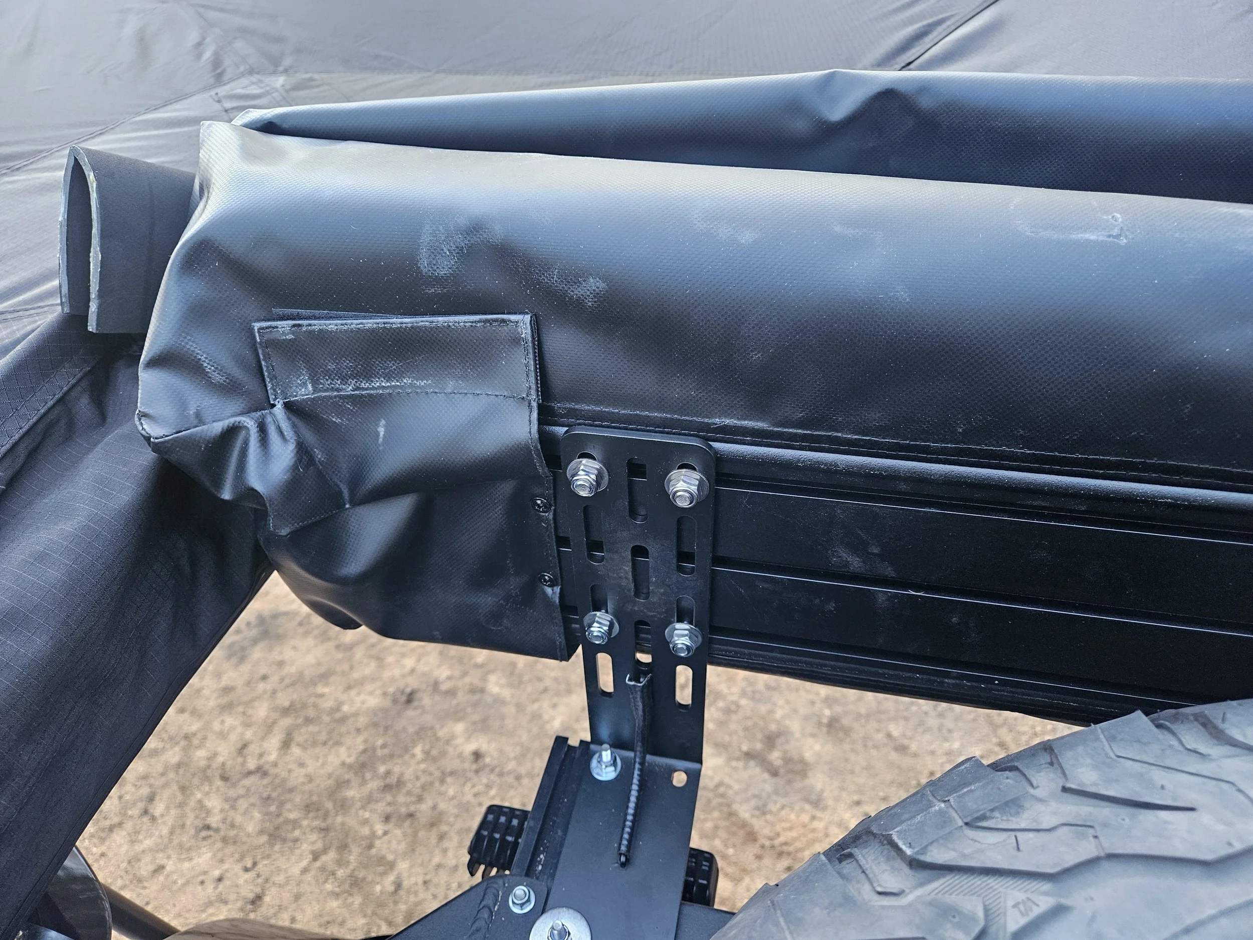OPENROAD 270-degree awning mounted to a Mitsubishi Delica L300 roof rack using an inverted L-bracket for additional clearance.