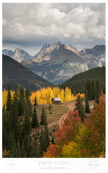 Old Cabin surrounded by Autumn Colors and Tall Mountains