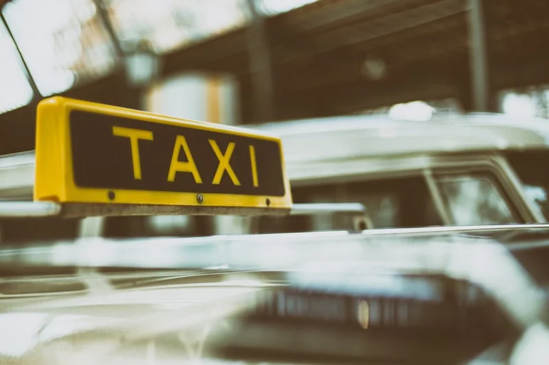 WHILE DRIVING A CAB