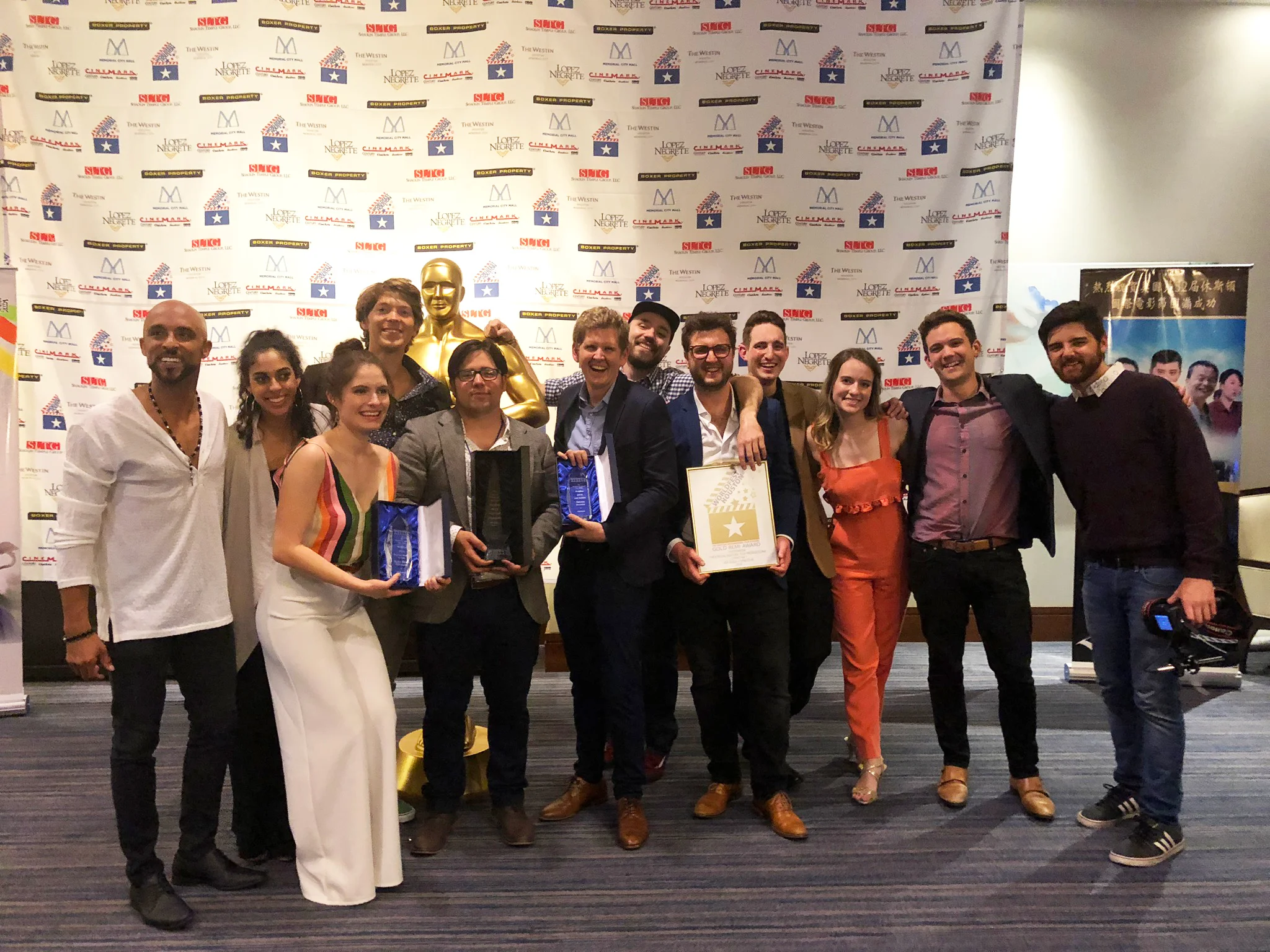 The “Evergreen” cast and crew (L-R: David Bianchi, Anna Donnella, Olivia Grace Applegate, Tanner Kalina, Joe Duca, Marshall Kistner, Tanner Nichols, Savvas Yiannoulou, Justin Graver, Kristin Jones, Maverick Dugger, and Oliver Johnson) at the WorldFest-Houston Awards Gala