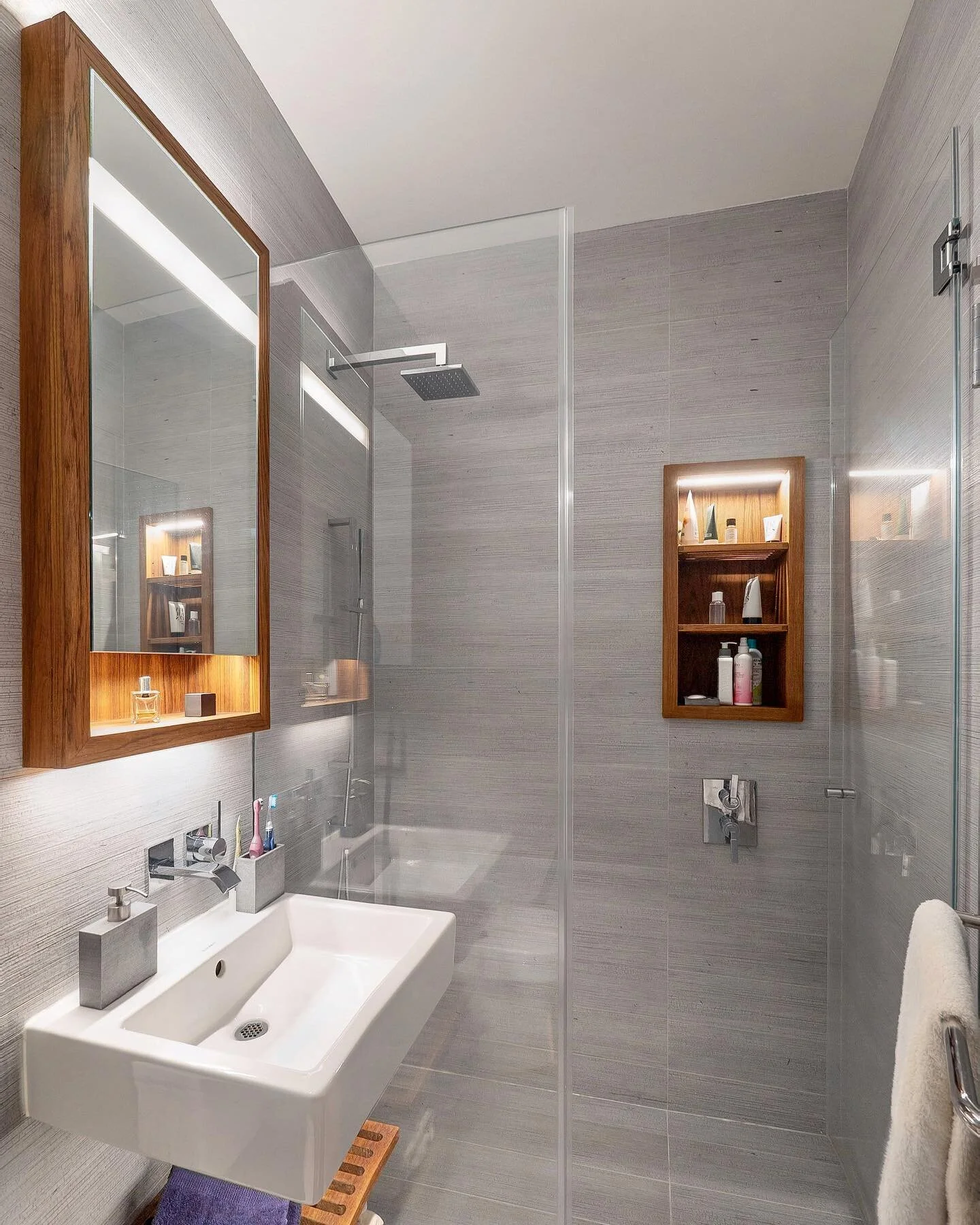 Even small bathrooms can have a luxurious feel by using larger format tile and adding the warmth of wood.

#InteriorDesign #InteriorDesigner #Interiors #Art #Architecture #Interior #InteriorArchitecture #NoFilter #PhotoOfTheDay #Nature #Photography #