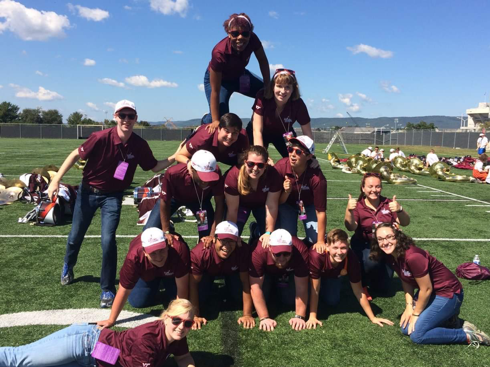 The 2017-2018 Manager Section making their Game Day Pyramid. I am the person single-handedly messing it up in the second row from the top! Source: Facebook.
