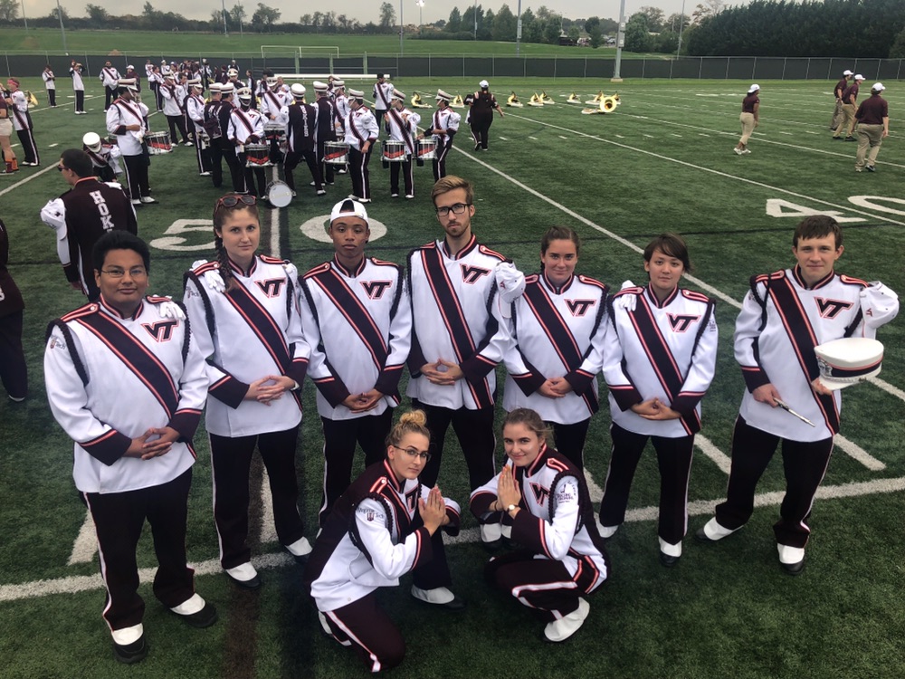 Atlas Wass and and the piccolo’s Rank 7 posing together on game day; Source: Alyssa Wills